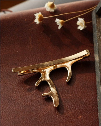 A pair of stylish deer hair clips made from durable alloy, featuring an elegant design suitable for various hairstyles.