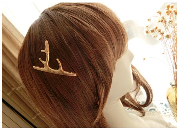 A pair of stylish deer hair clips made from durable alloy, featuring an elegant design suitable for various hairstyles.