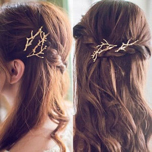 A stylish hair clip designed like deer horns and tree branches, made from durable alloy, measuring 6.3cm.