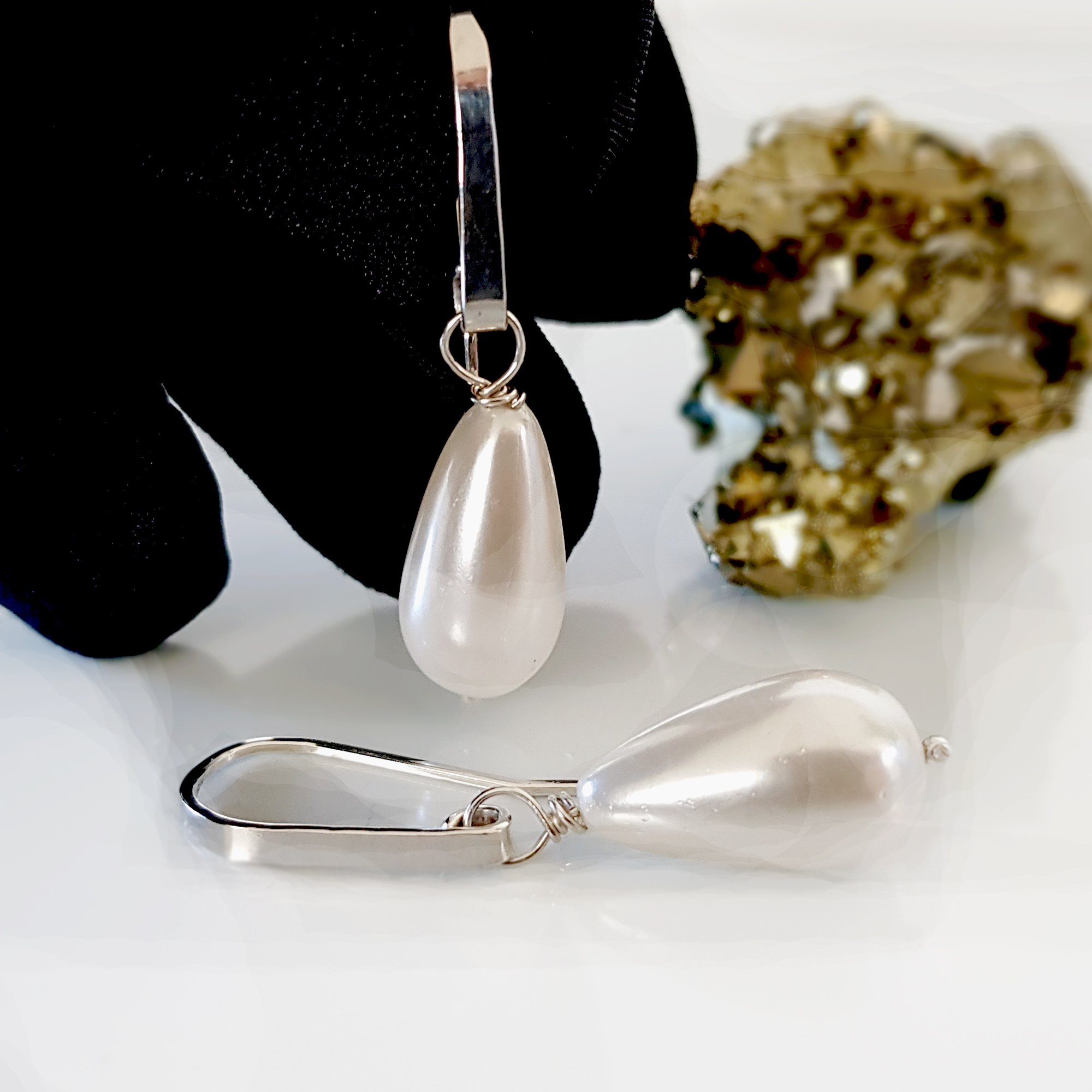 Elegant Dew Drop earrings featuring teardrop shell pearls on artisan hooks, perfect for bridal and formal occasions.