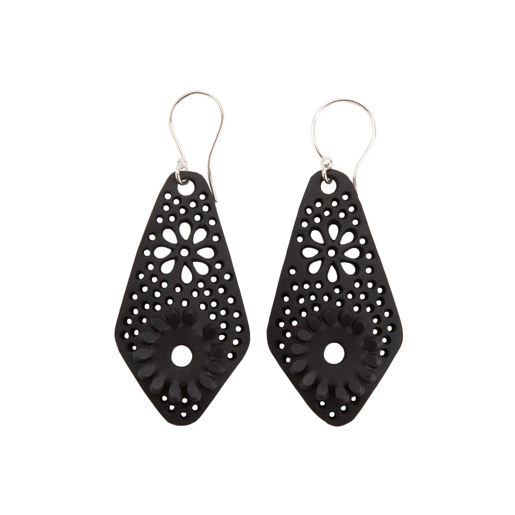 A pair of handcrafted Diamond Recycled Rubber Earrings made from reclaimed tyre inner tubes, featuring unique designs and sterling silver hooks.