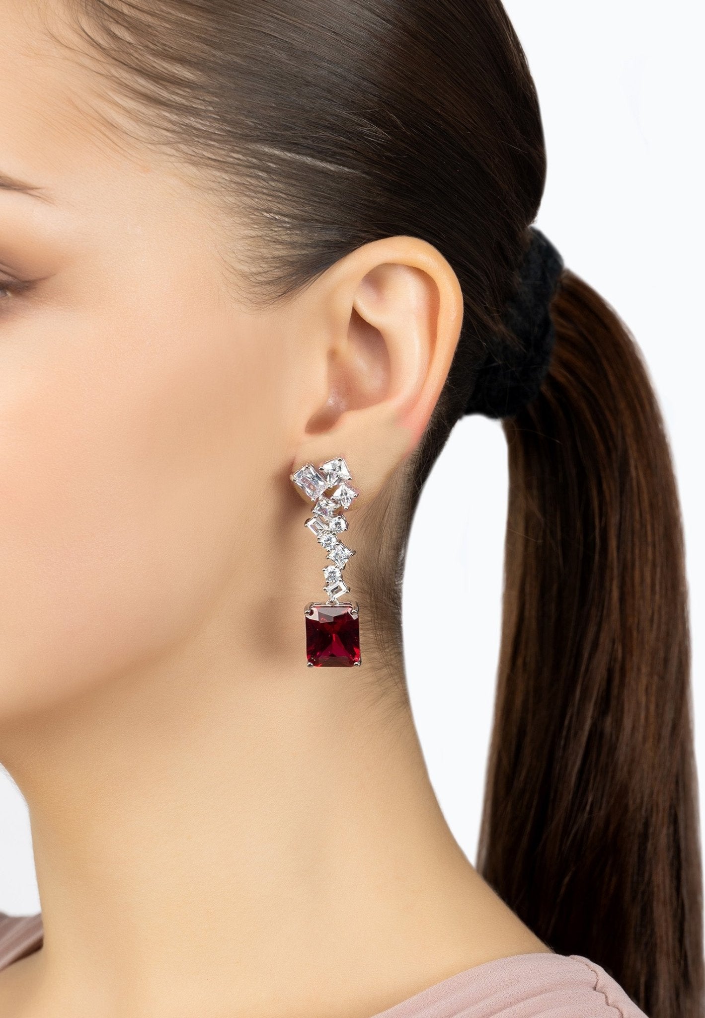 Diana Ruby Drop Earrings in silver featuring a large rectangular ruby gemstone and simulated diamonds in an intricate design.