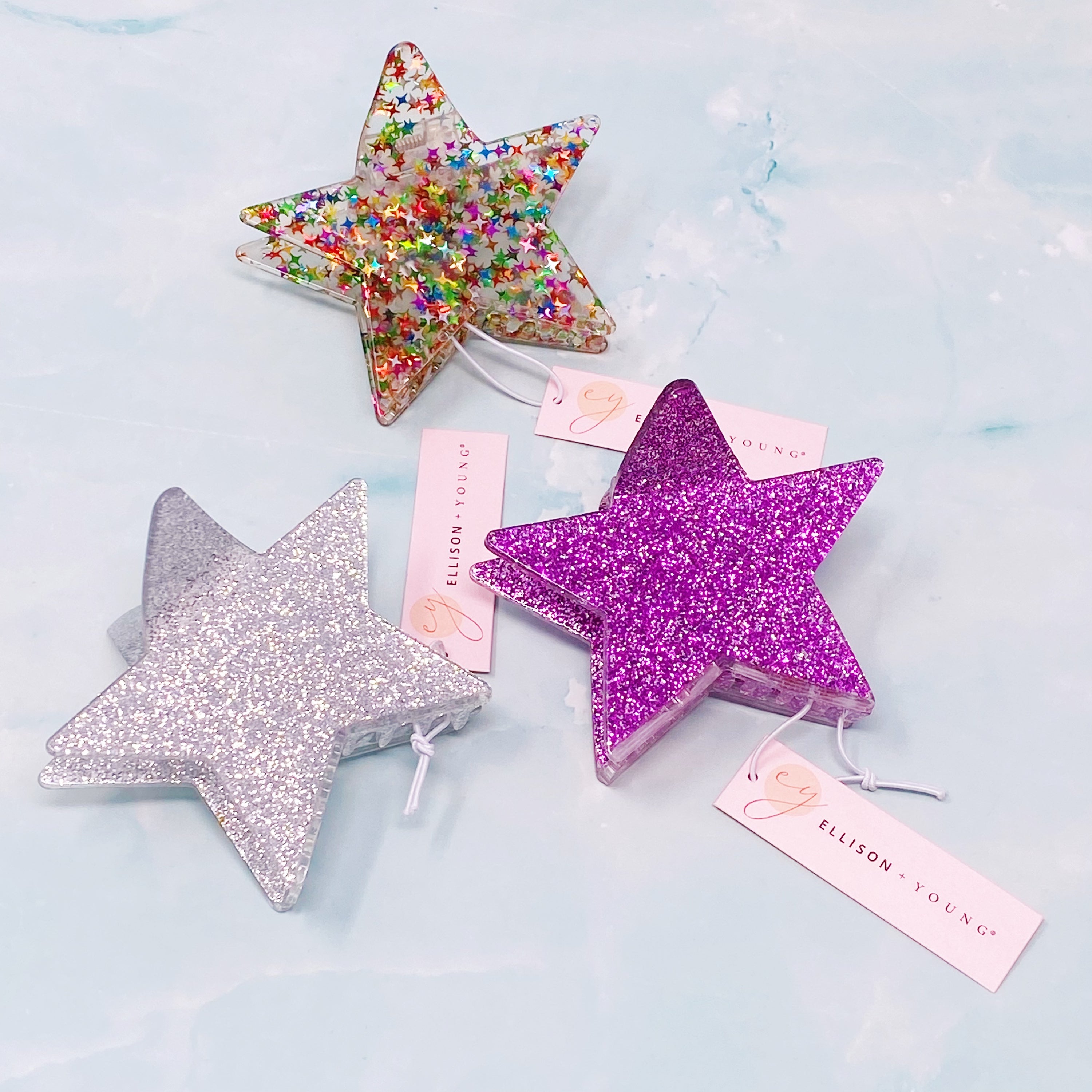 A glittery star-shaped hair claw in sparkling colors, perfect for festive hairstyles.