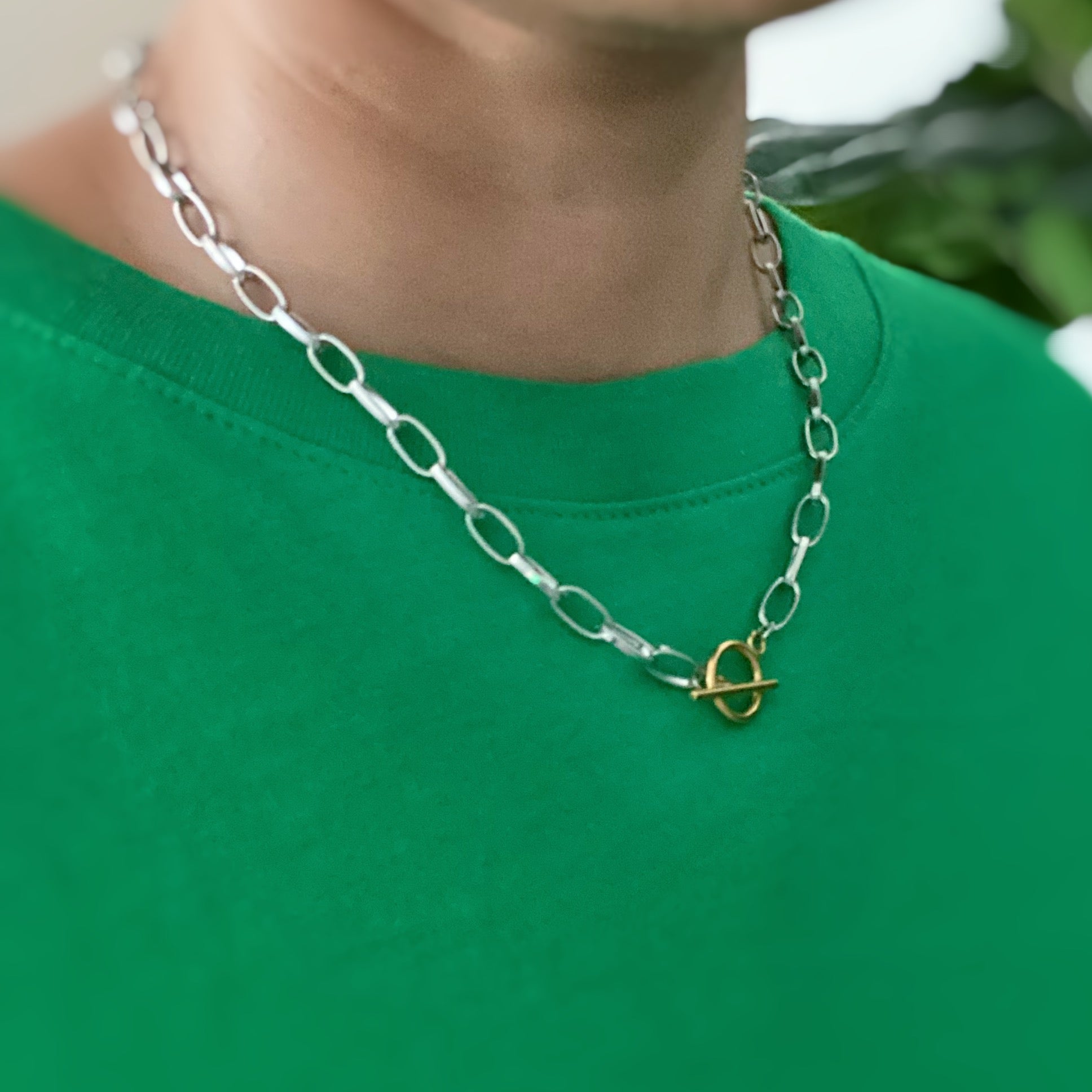 A stylish Do It All Link Chain Necklace featuring a two-tone design in silver and gold, adjustable length, and a toggle closure.