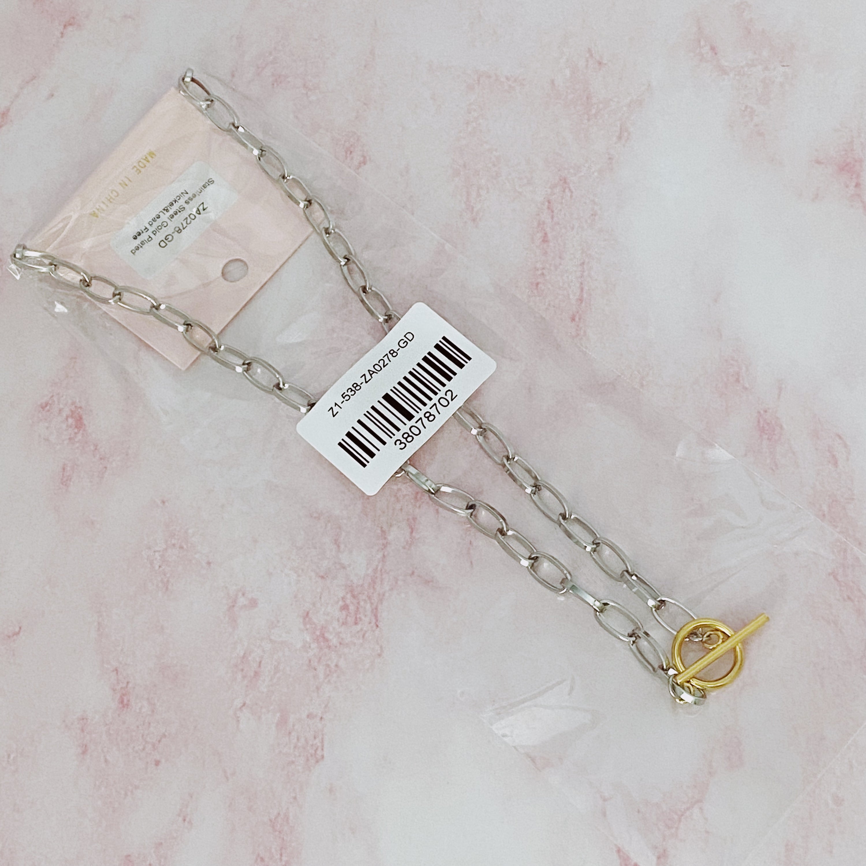 A stylish Do It All Link Chain Necklace featuring a two-tone design in silver and gold, adjustable length, and a toggle closure.