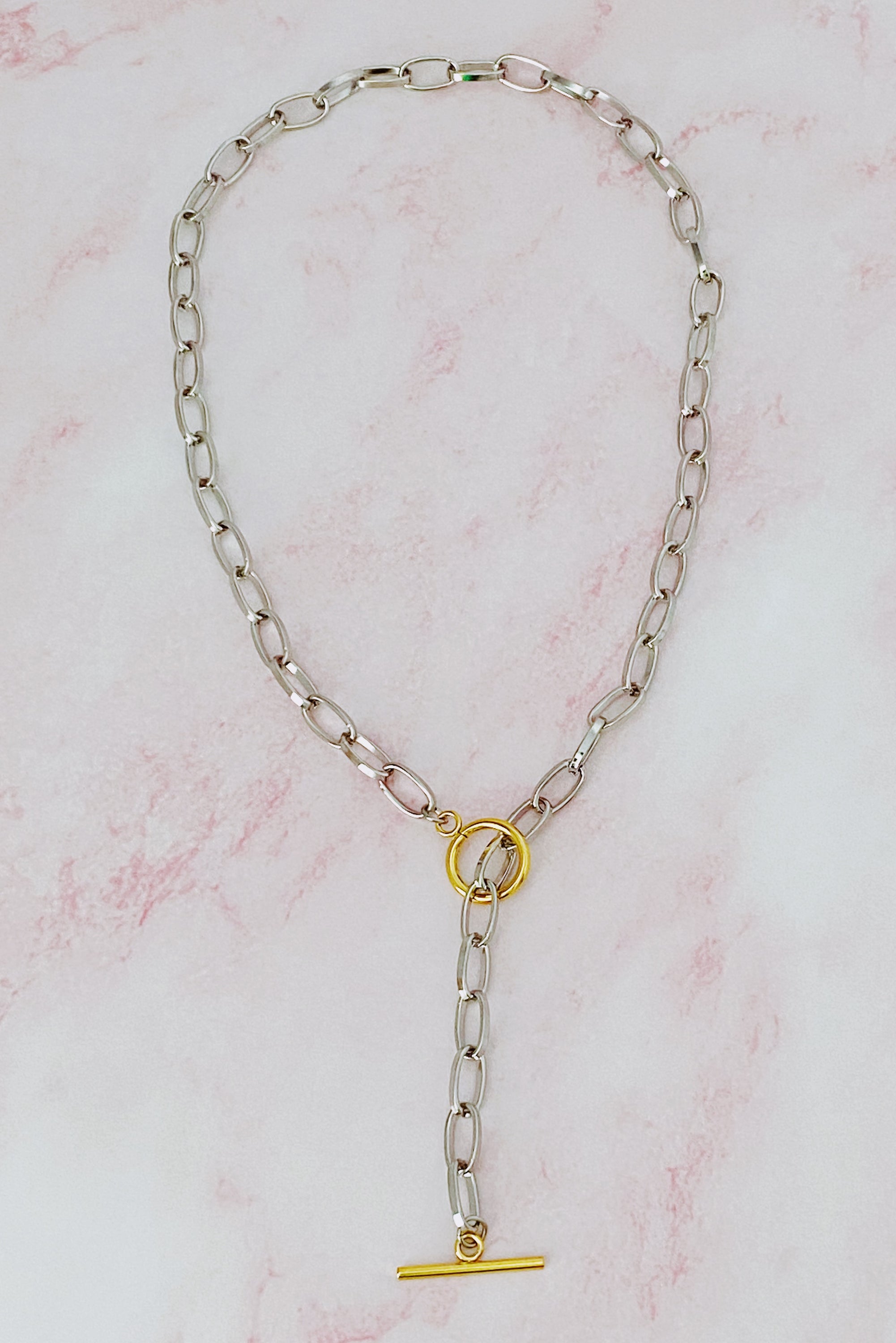 A stylish Do It All Link Chain Necklace featuring a two-tone design in silver and gold, adjustable length, and a toggle closure.