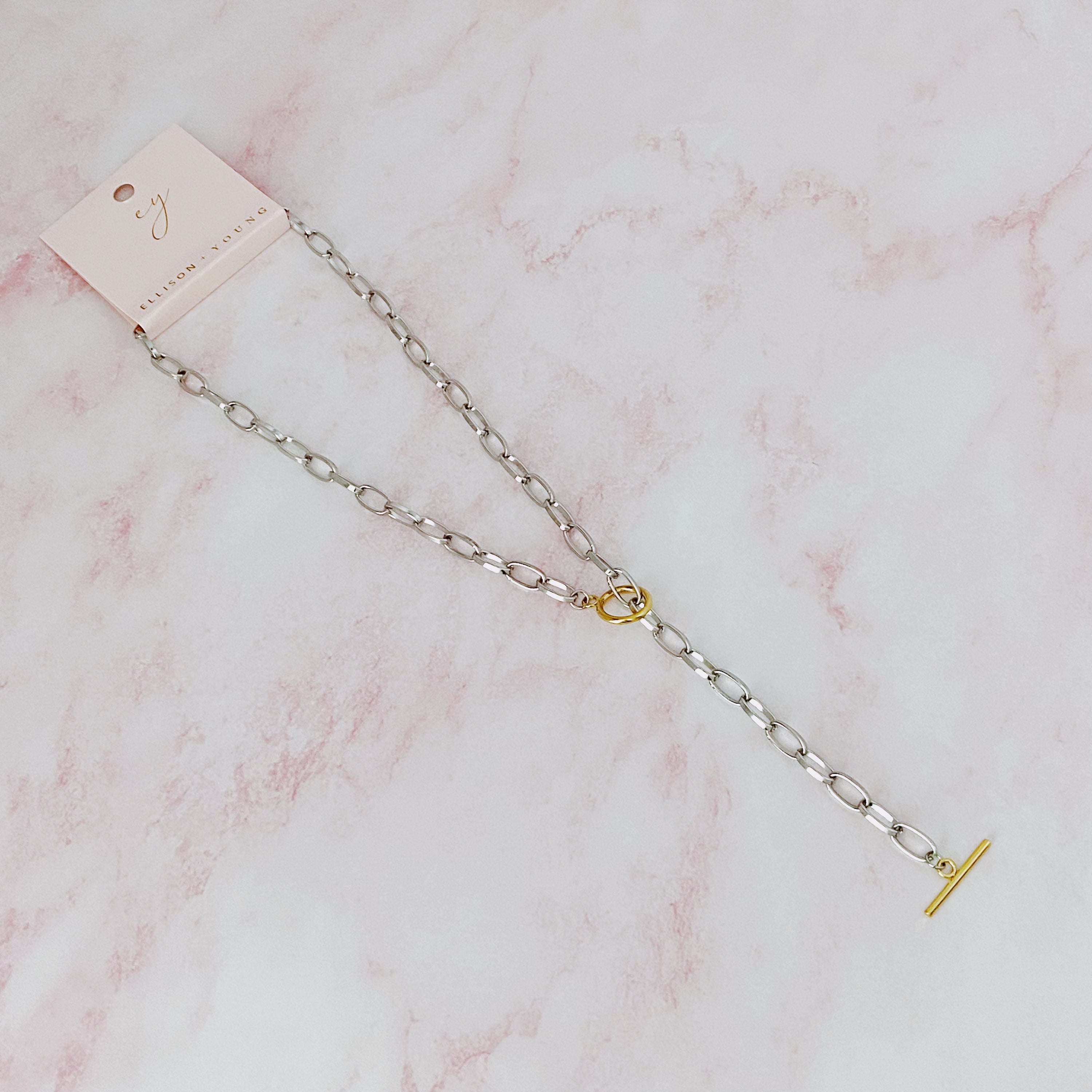 A stylish Do It All Link Chain Necklace featuring a two-tone design in silver and gold, adjustable length, and a toggle closure.