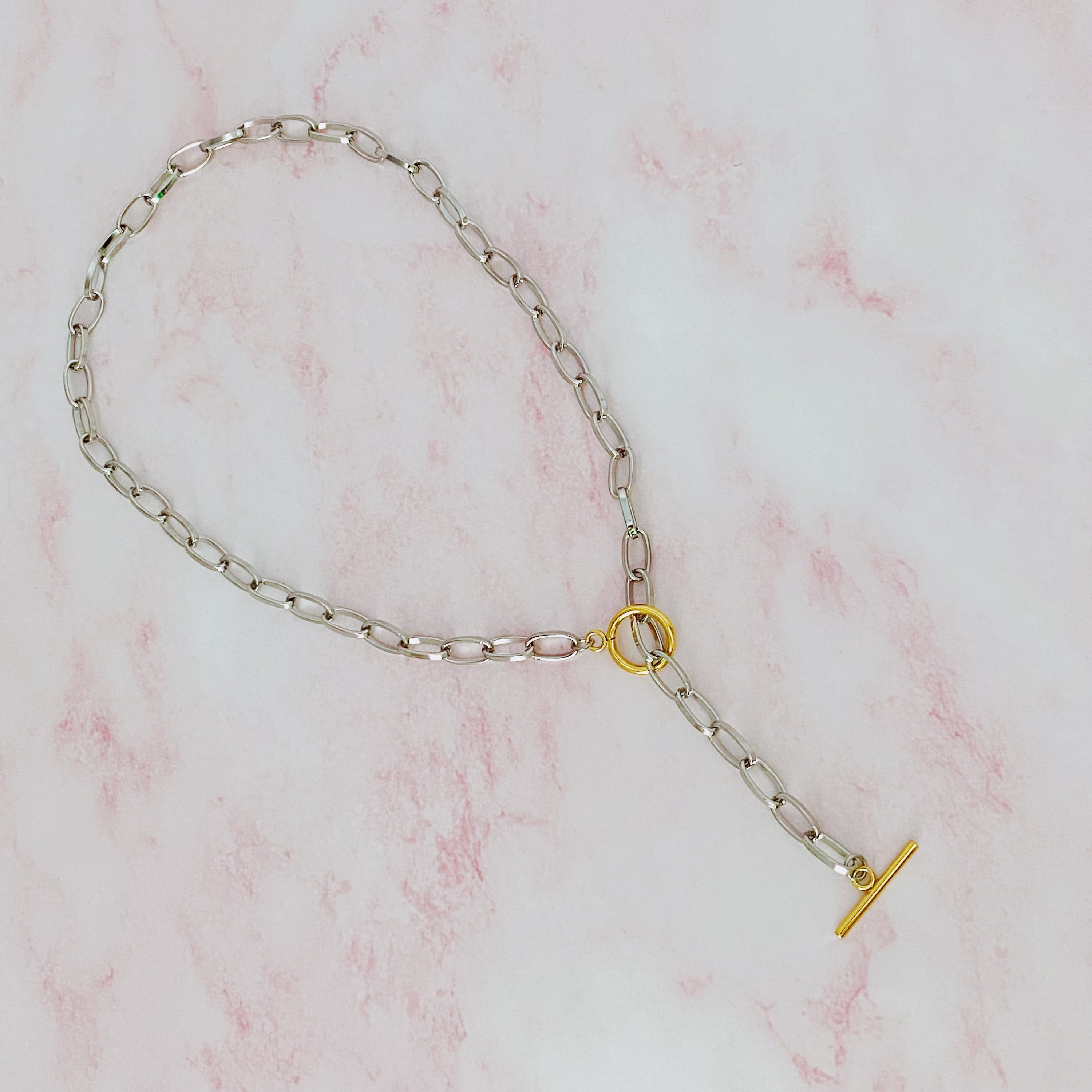 A stylish Do It All Link Chain Necklace featuring a two-tone design in silver and gold, adjustable length, and a toggle closure.