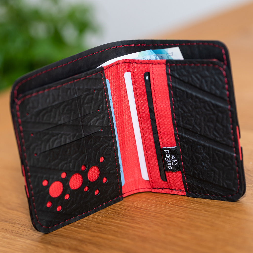 Dody Slimline Inner Tube Wallet showcasing unique recycled rubber texture and vibrant stitching, available in multiple colors.