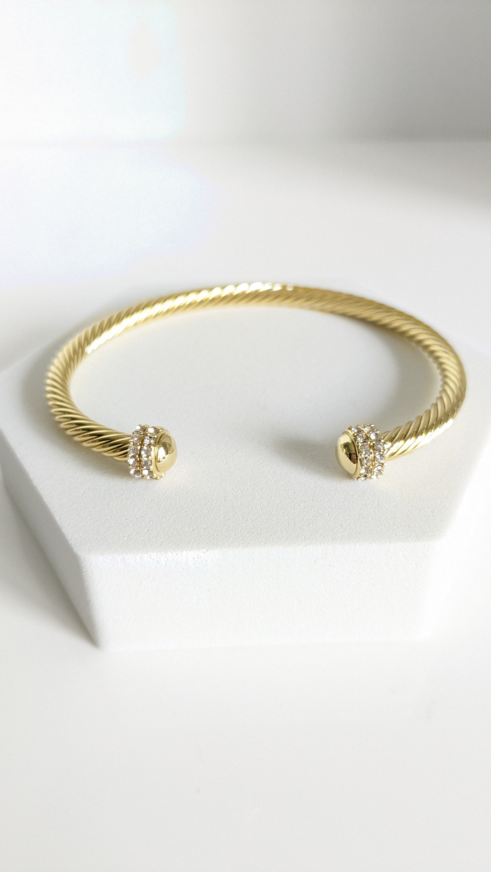 Elegant Dome Crystals Bangle featuring 18K Gold Filled material with a gold dome pattern and simulated diamonds, perfect for stacking.