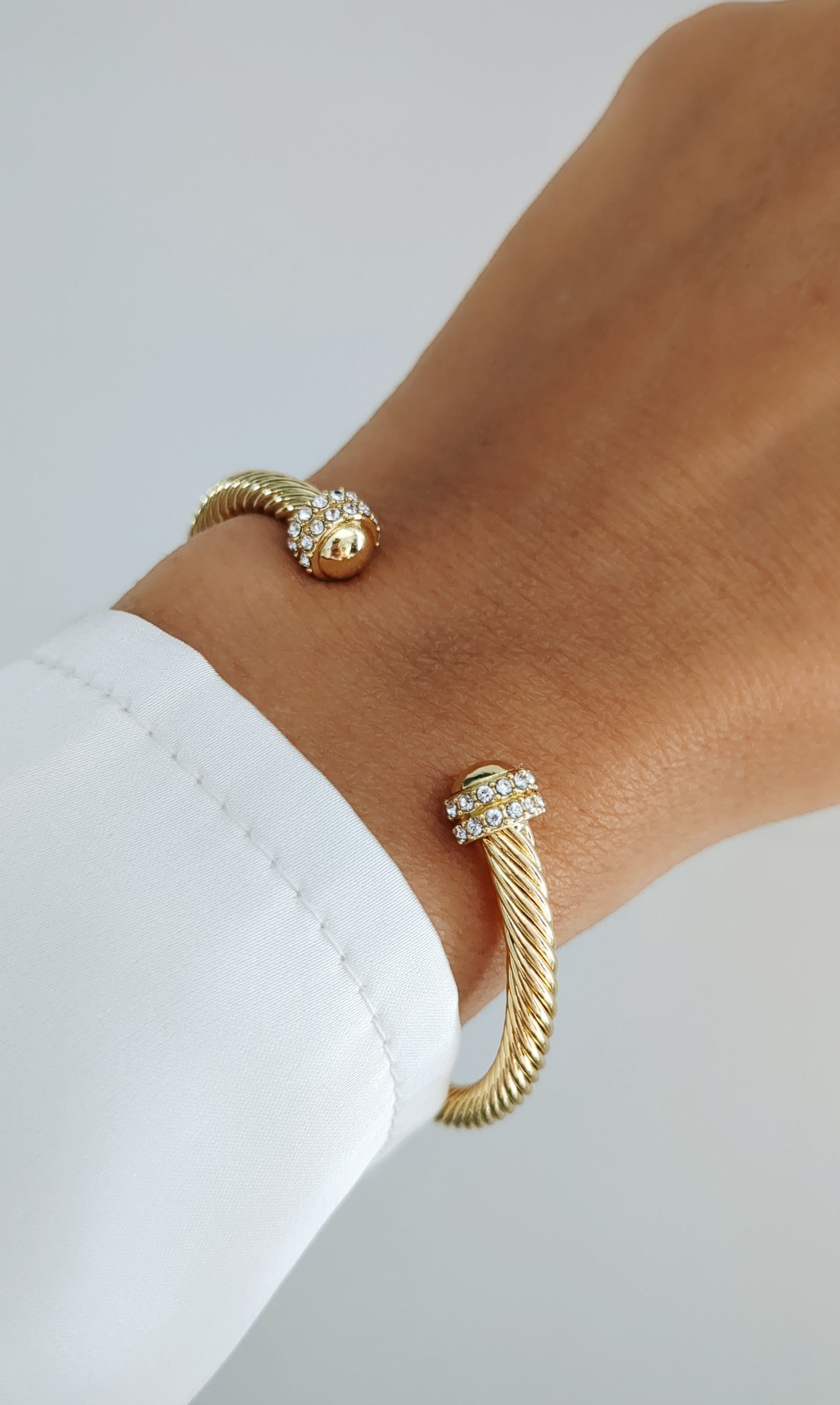 Elegant Dome Crystals Bangle featuring 18K Gold Filled material with a gold dome pattern and simulated diamonds, perfect for stacking.