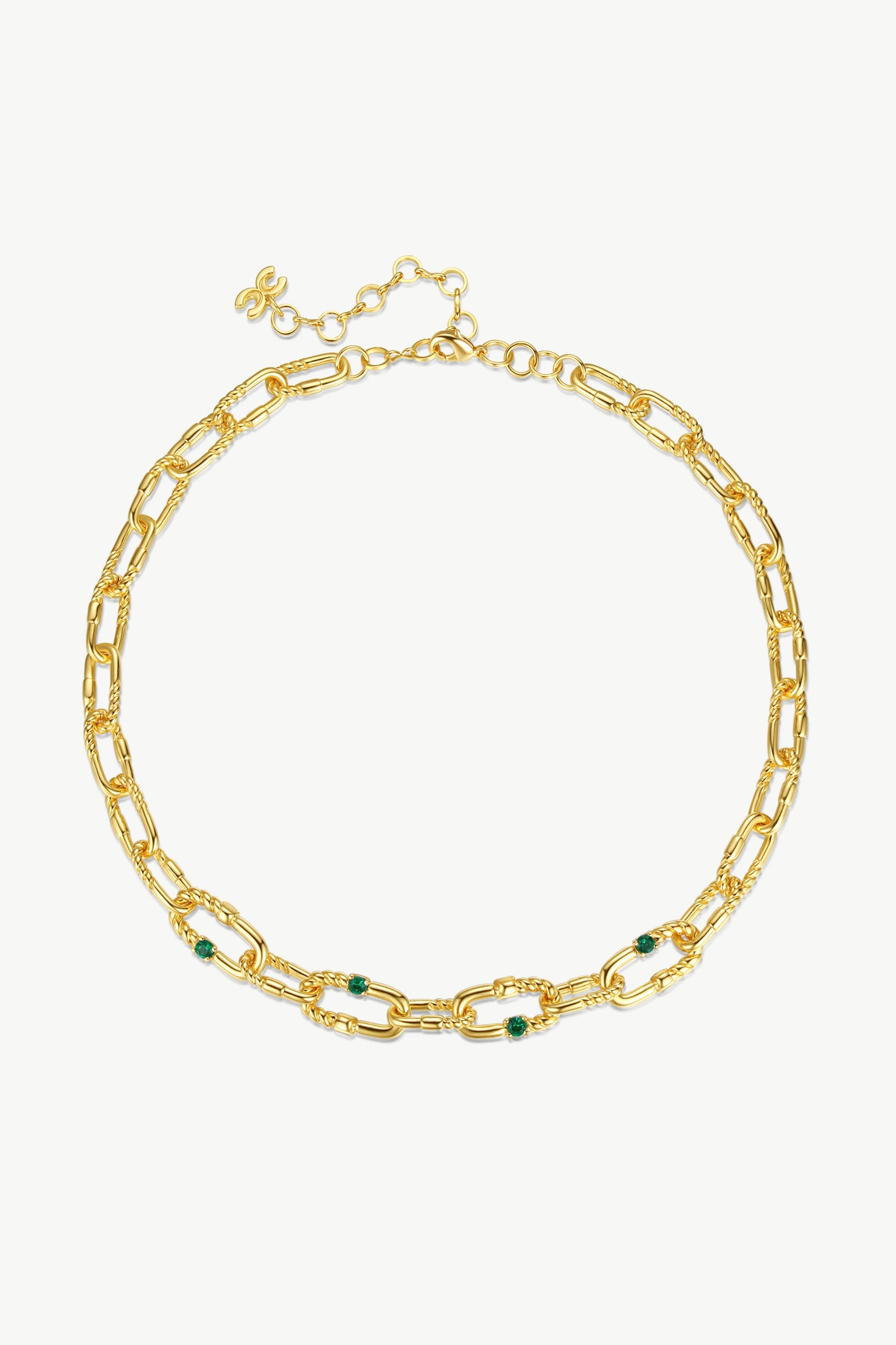 A stylish Double Colored Zirconia Gold Chain Necklace featuring green and purple cubic zirconia stones set in a paperclip link design.