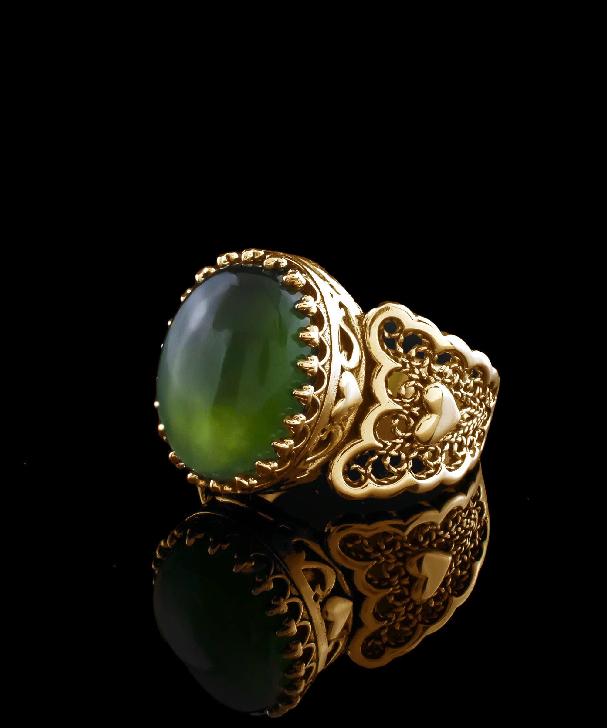 Elegant gold plated cocktail ring featuring double heart design and natural serpentine gemstone, presented in a luxurious gift box.