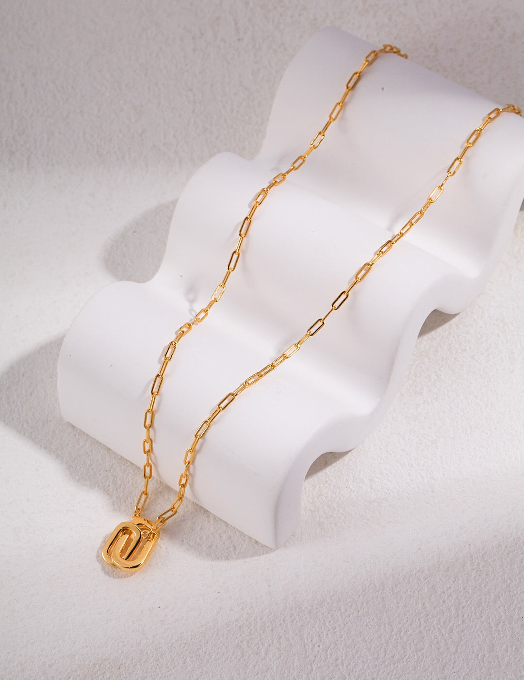 A beautiful Double Oval Pendant Necklace made of gold vermeil, showcasing its elegant design and adjustable chain.