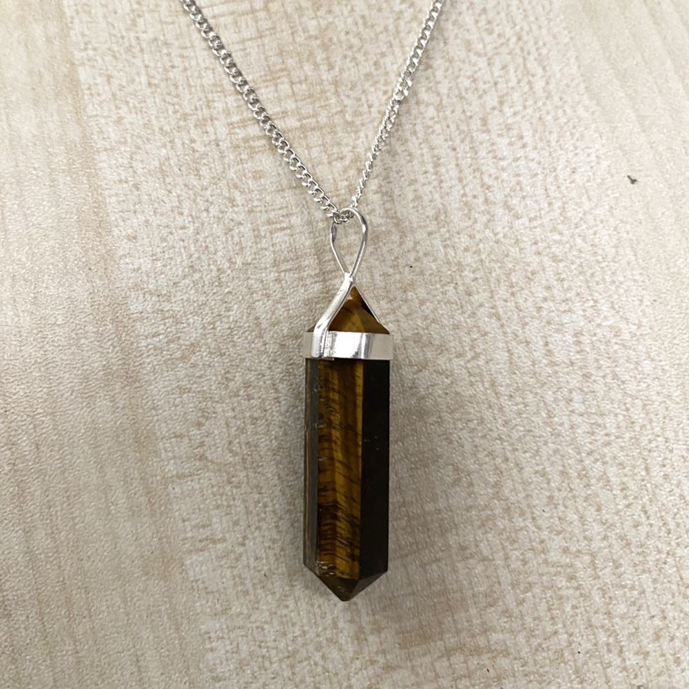 A beautiful Double Point Pencil Pendant made of semi-precious gemstones, showcasing its unique shape and vibrant colors, hanging from a durable alloy chain.