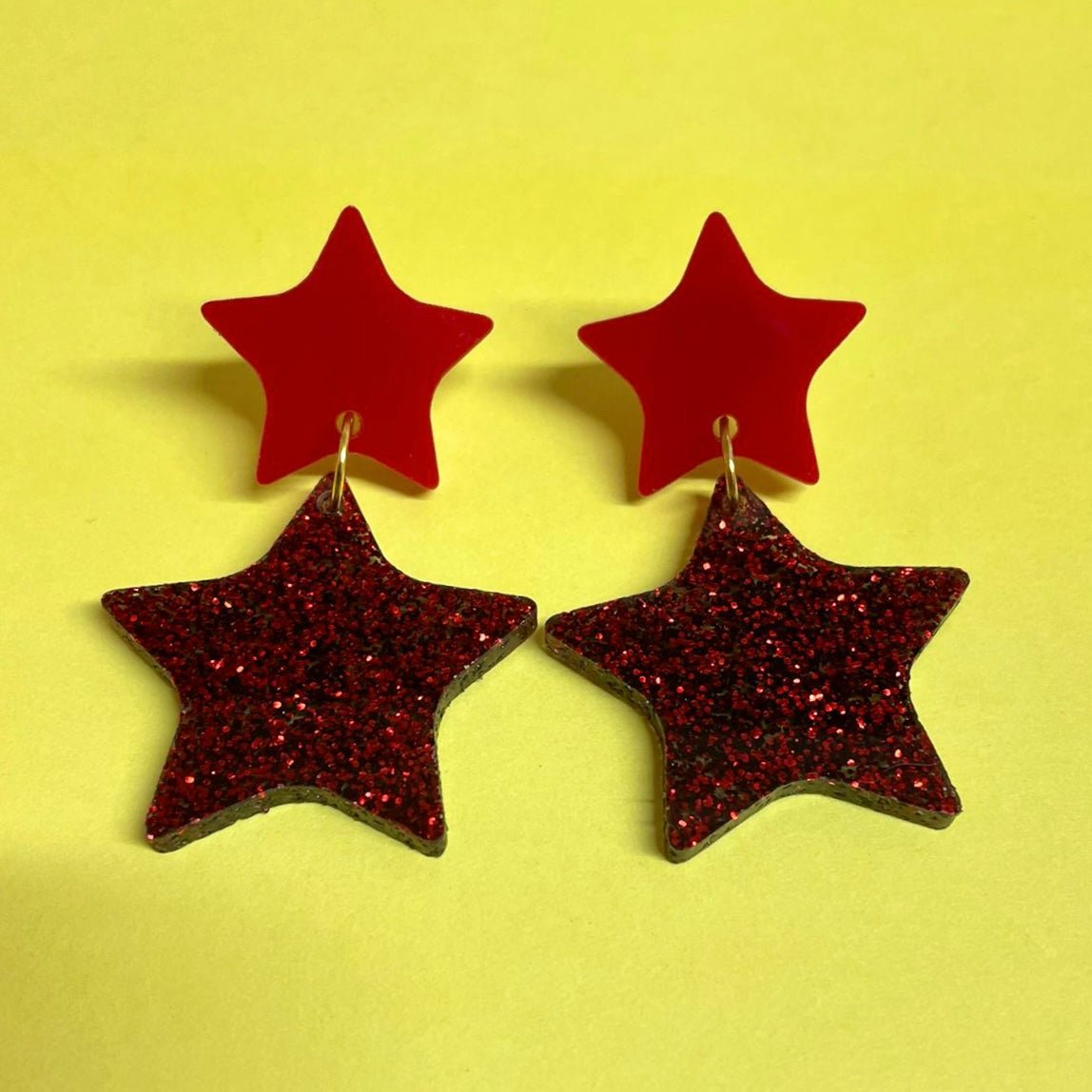 A pair of elegant Double Star Dangle Earrings made from laser-cut acrylic, featuring a unique design with a height of 5.5cm and width of 3.25cm.