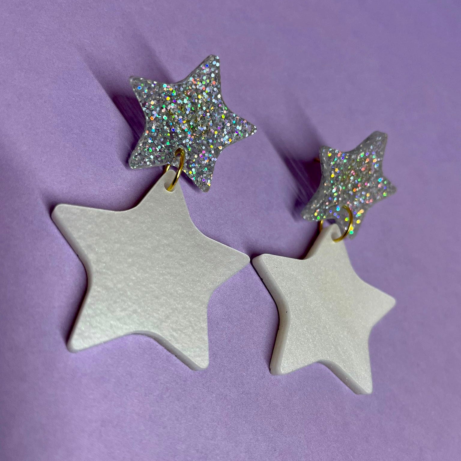 A pair of elegant Double Star Dangle Earrings made from laser-cut acrylic, featuring a unique design with a height of 5.5cm and width of 3.25cm.