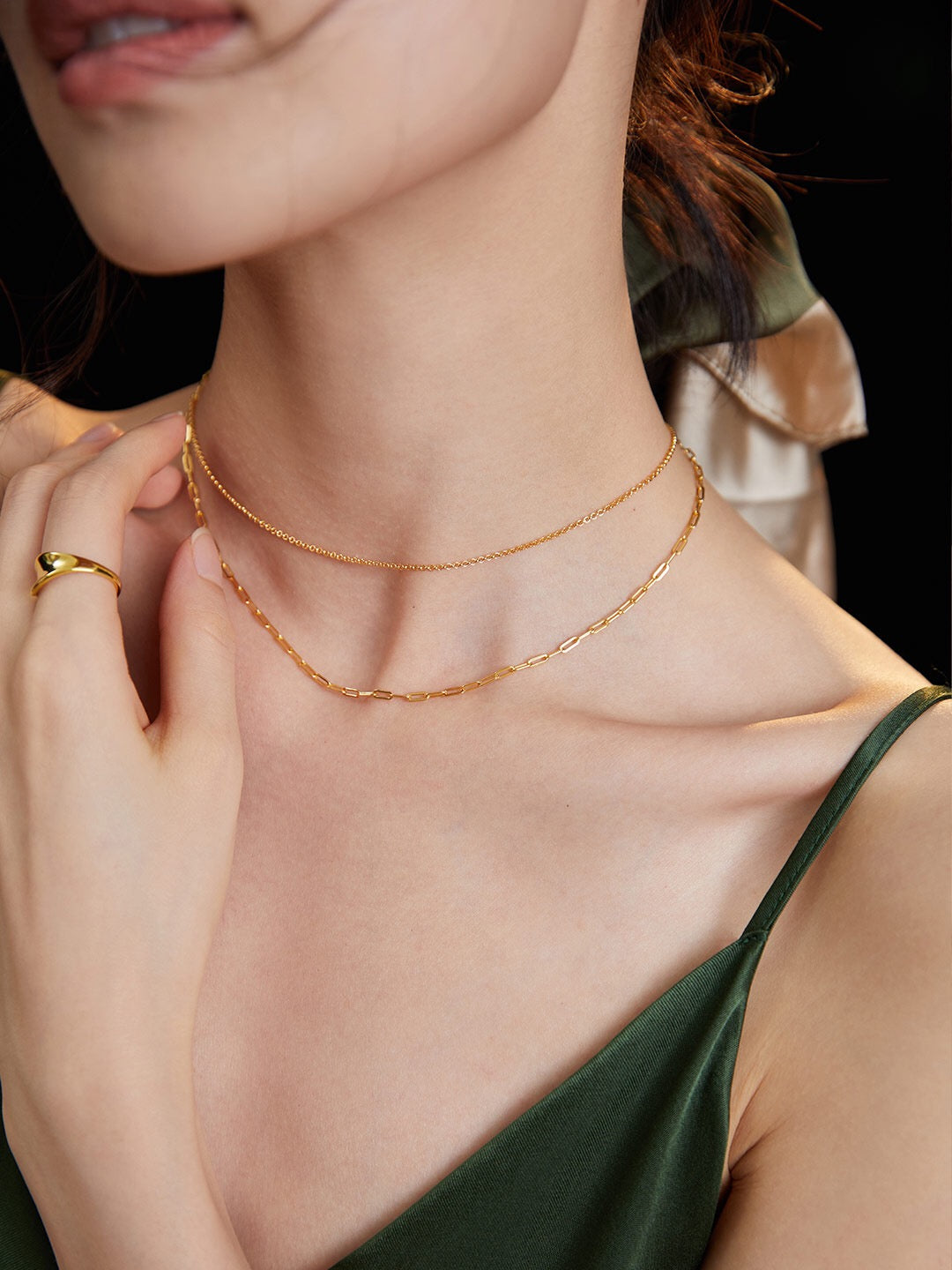 A stunning double-layered necklace made of gold vermeil, showcasing its elegant design and adjustable chain length.