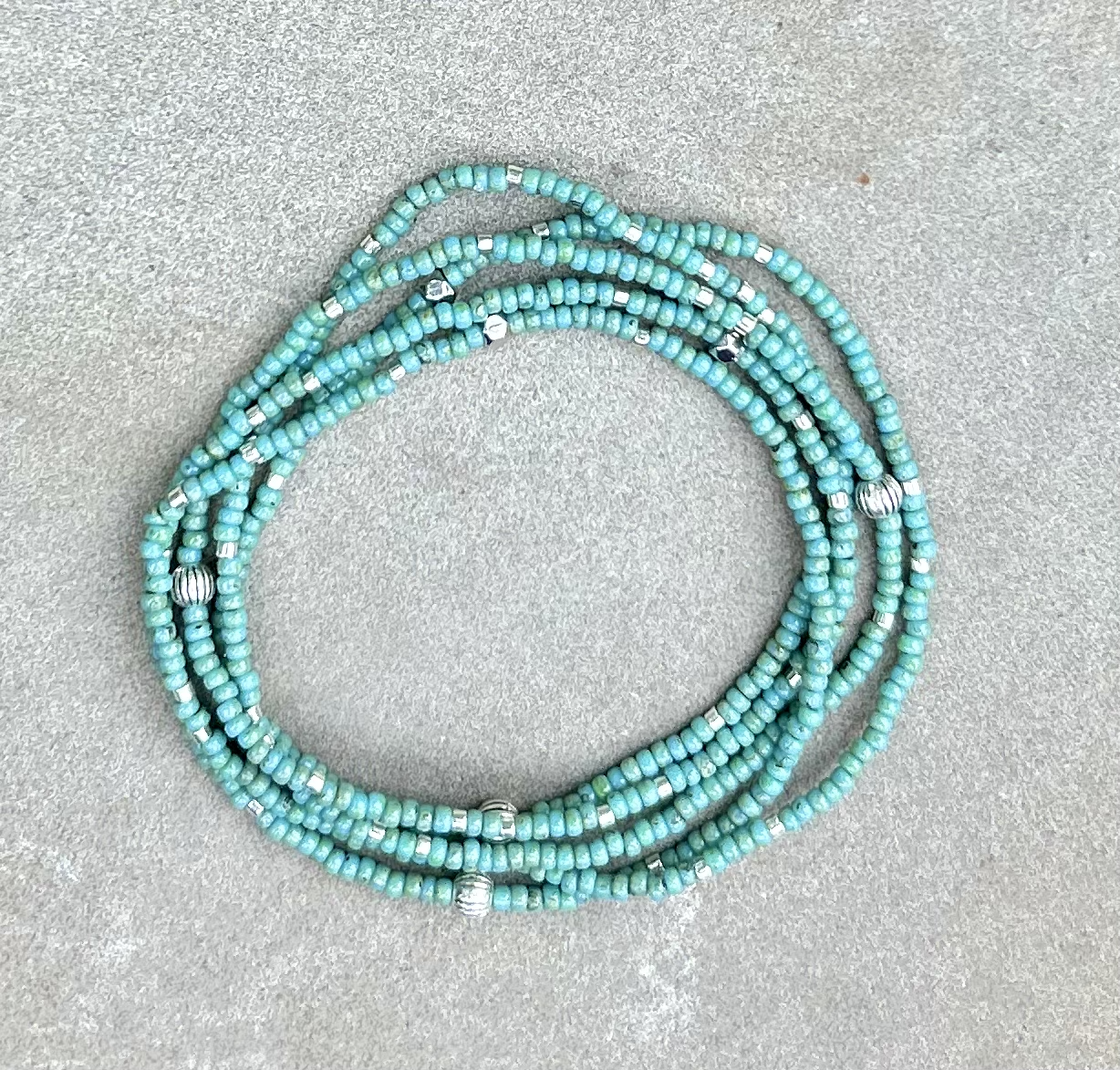 Double-Up 2-Piece Turquoise & Silver Beaded Wrap Bracelet featuring vibrant turquoise Czech glass beads and metallic silver accents, elegantly wrapped around a wrist.