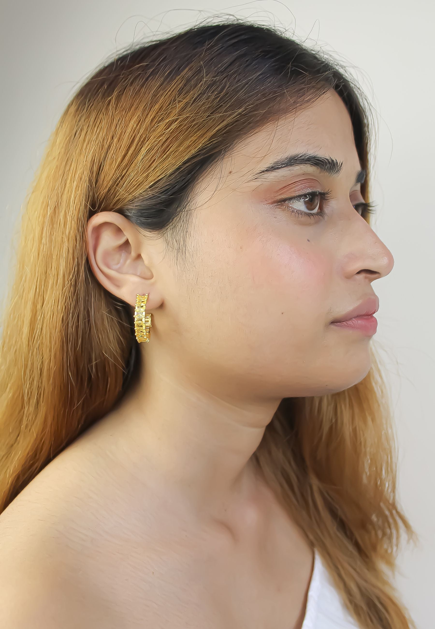 Elegant Downtown Earrings featuring 18K gold plating and emerald cut zirconia stones, perfect for pierced ears.