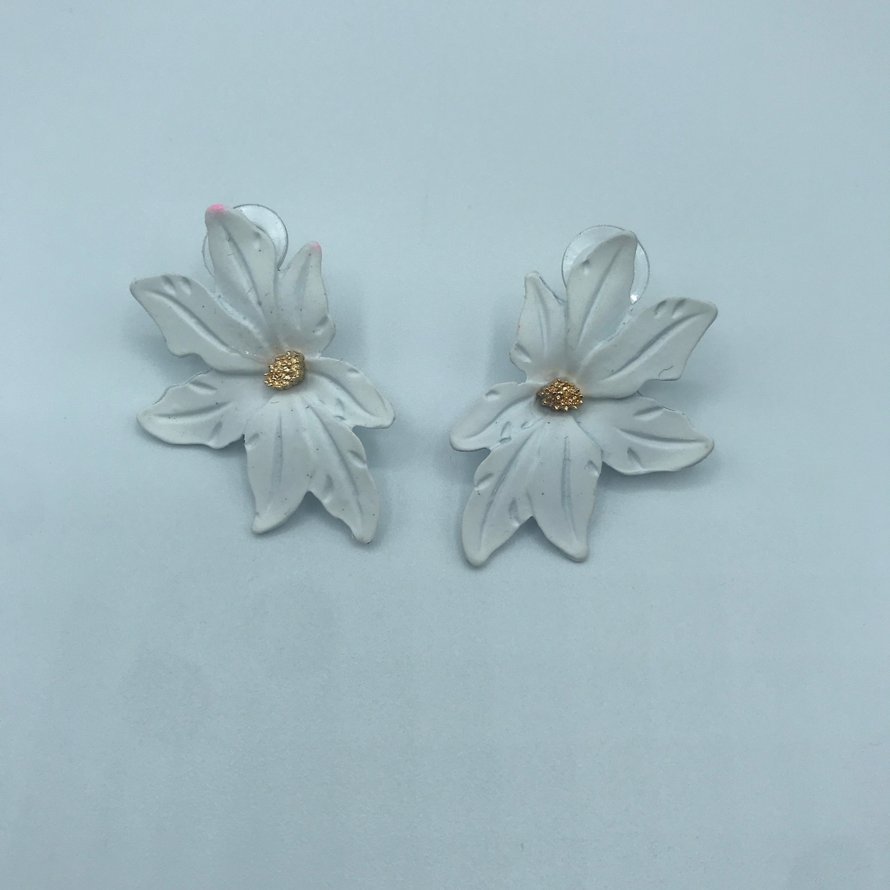 Dramatic flower stud earrings made of alloy, featuring intricate floral design and lightweight construction.