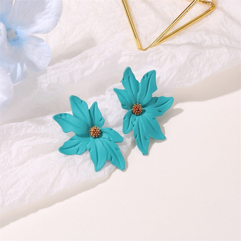 Dramatic flower stud earrings made of alloy, featuring intricate floral design and lightweight construction.