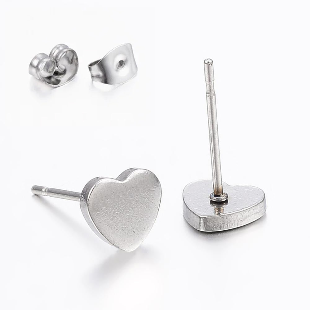 A pair of elegant silver heart stud earrings made from 304 stainless steel, presented on a decorative gift card.