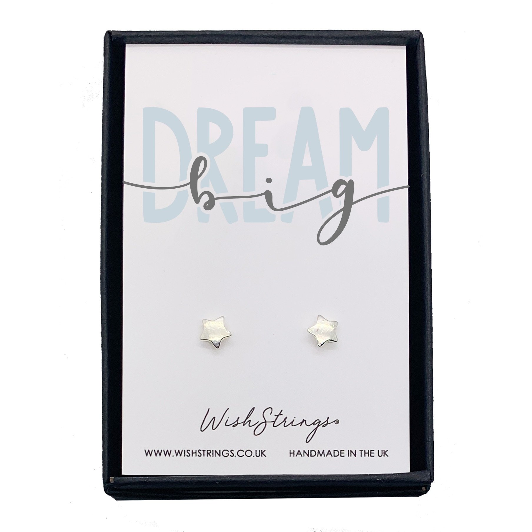 A pair of elegant DREAM BIG earrings presented in a luxurious black gift box with an inspirational card.