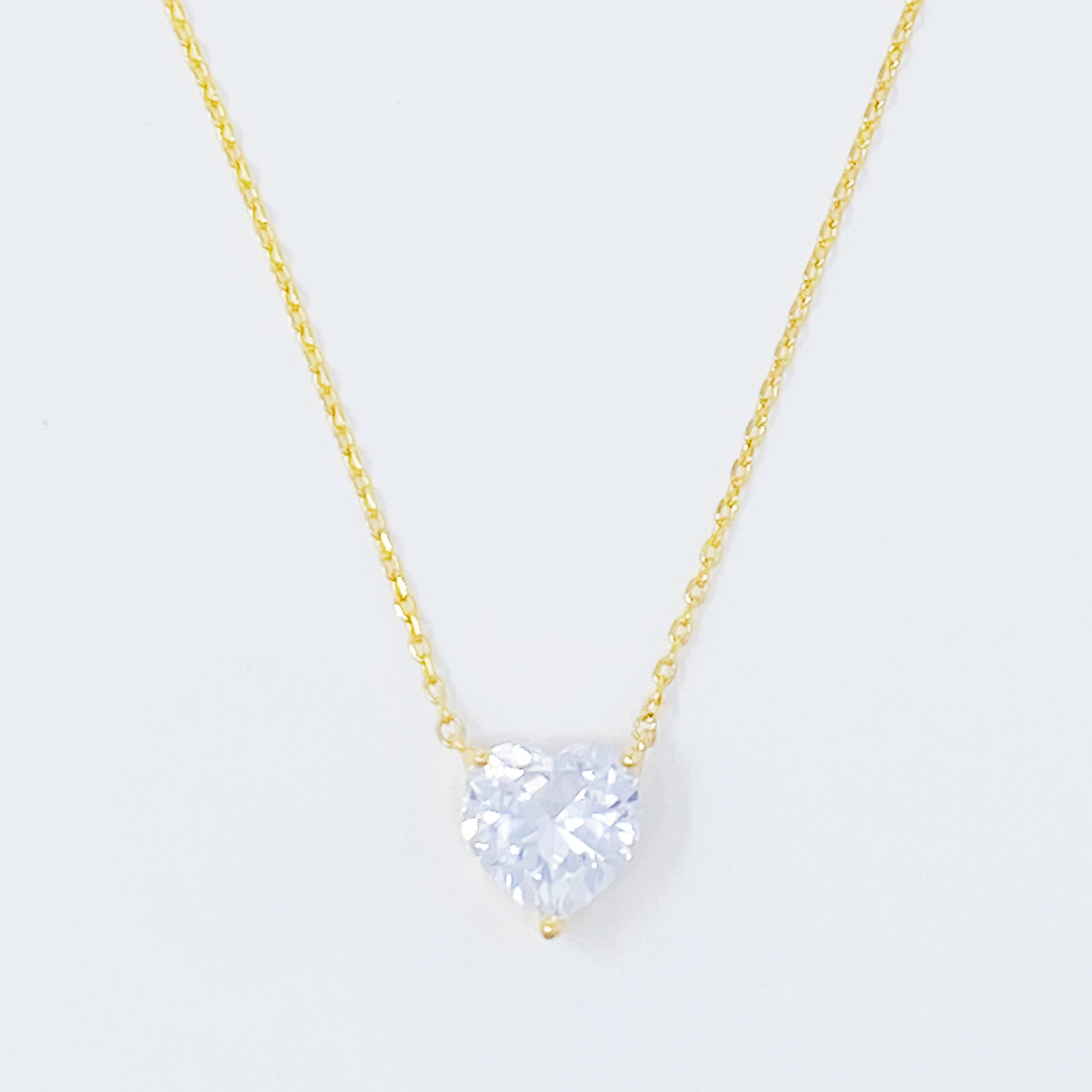 Dream It Solitaire Pendant Necklace featuring a single sparkling Cubic Zirconia stone on a gold plated stainless steel chain.