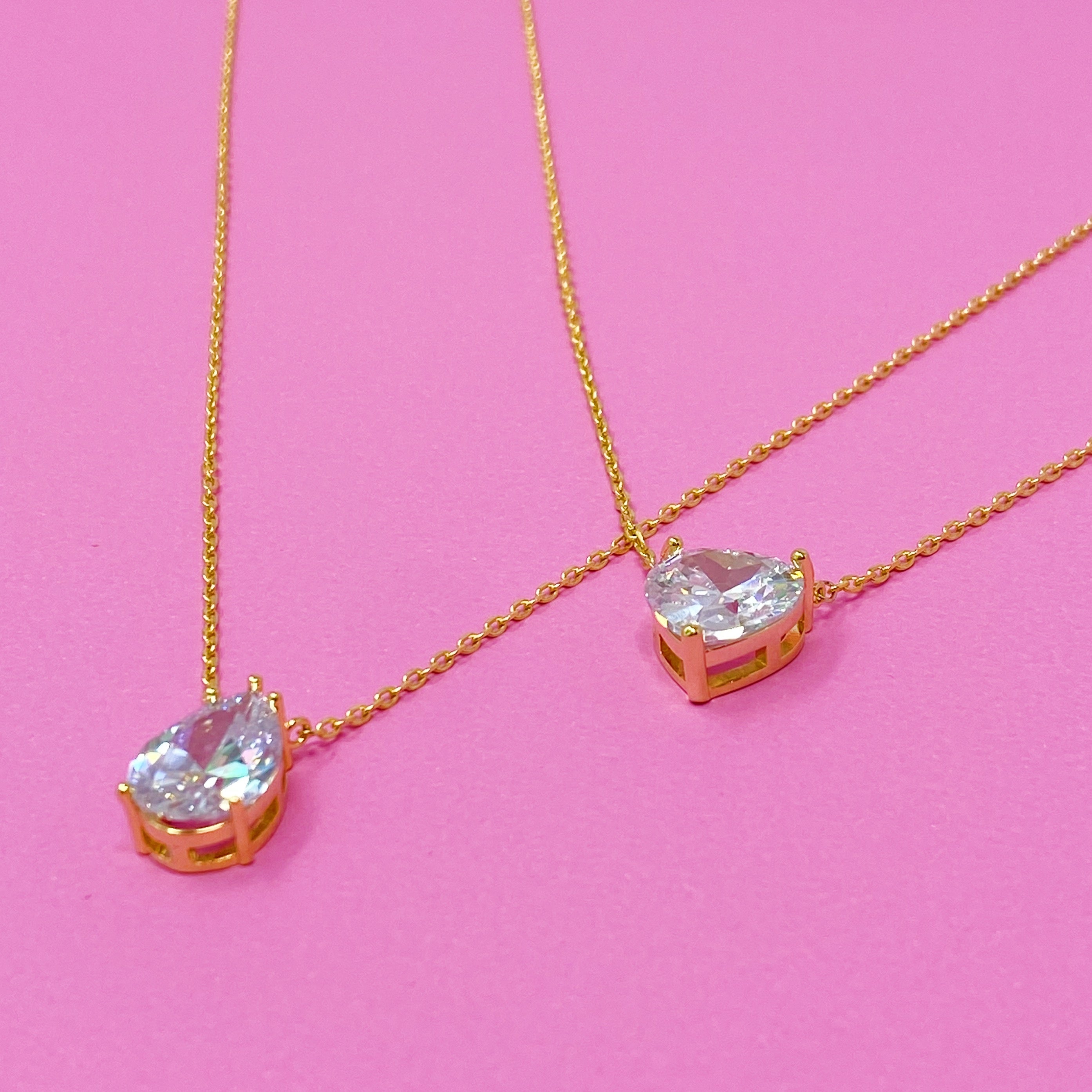 Dream It Solitaire Pendant Necklace featuring a single sparkling Cubic Zirconia stone on a gold plated stainless steel chain.