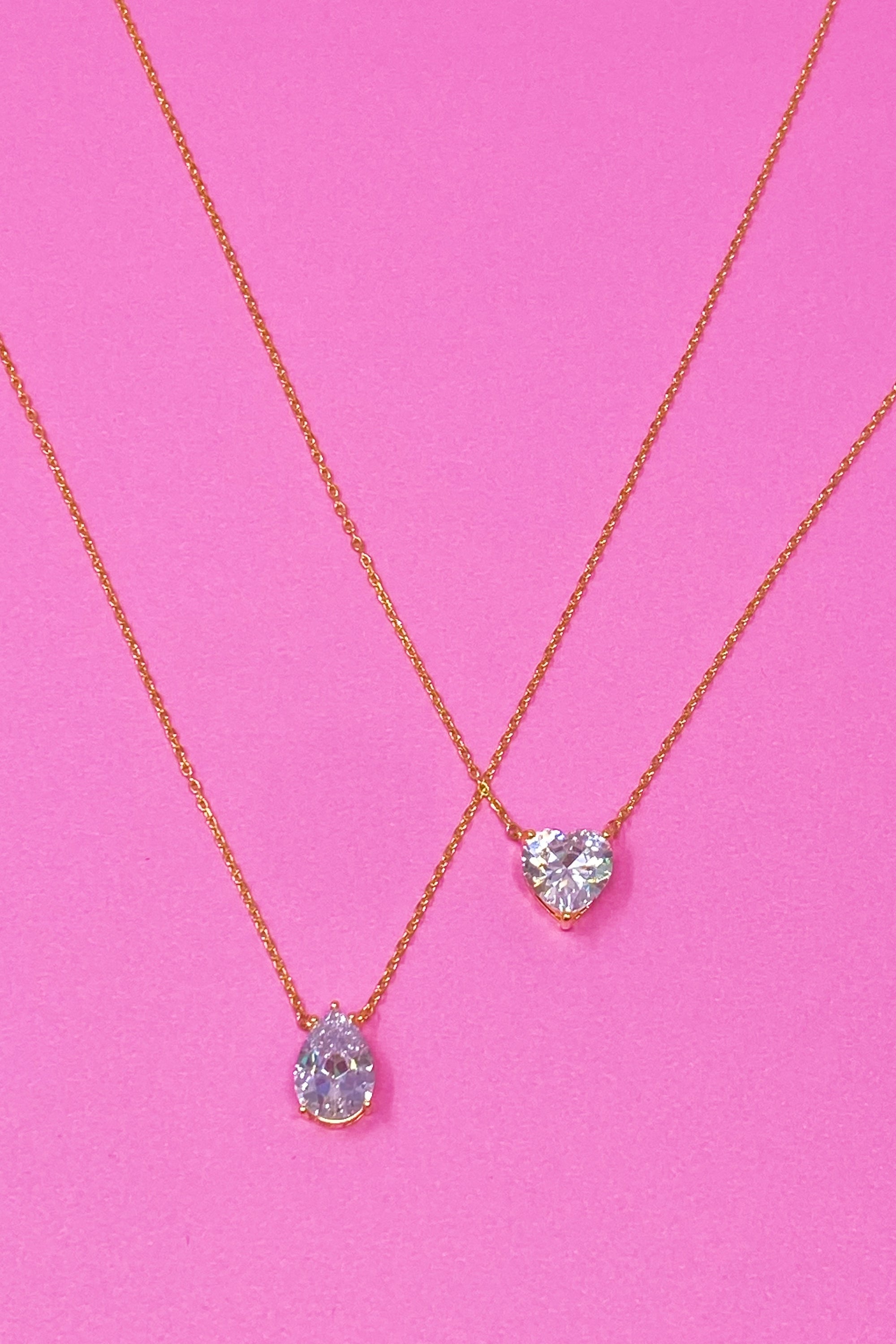 Dream It Solitaire Pendant Necklace featuring a single sparkling Cubic Zirconia stone on a gold plated stainless steel chain.