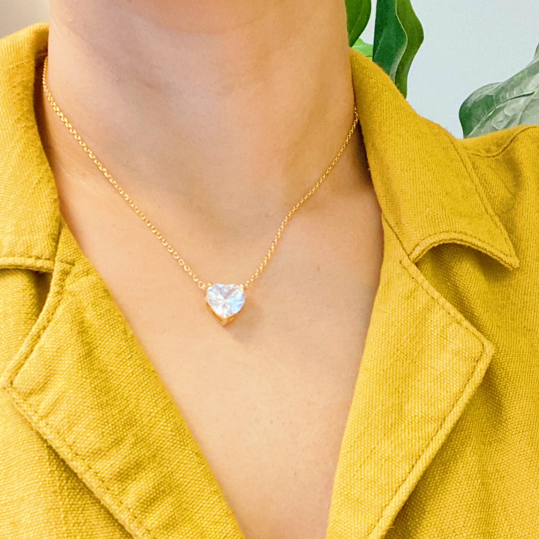 Dream It Solitaire Pendant Necklace featuring a single sparkling Cubic Zirconia stone on a gold plated stainless steel chain.