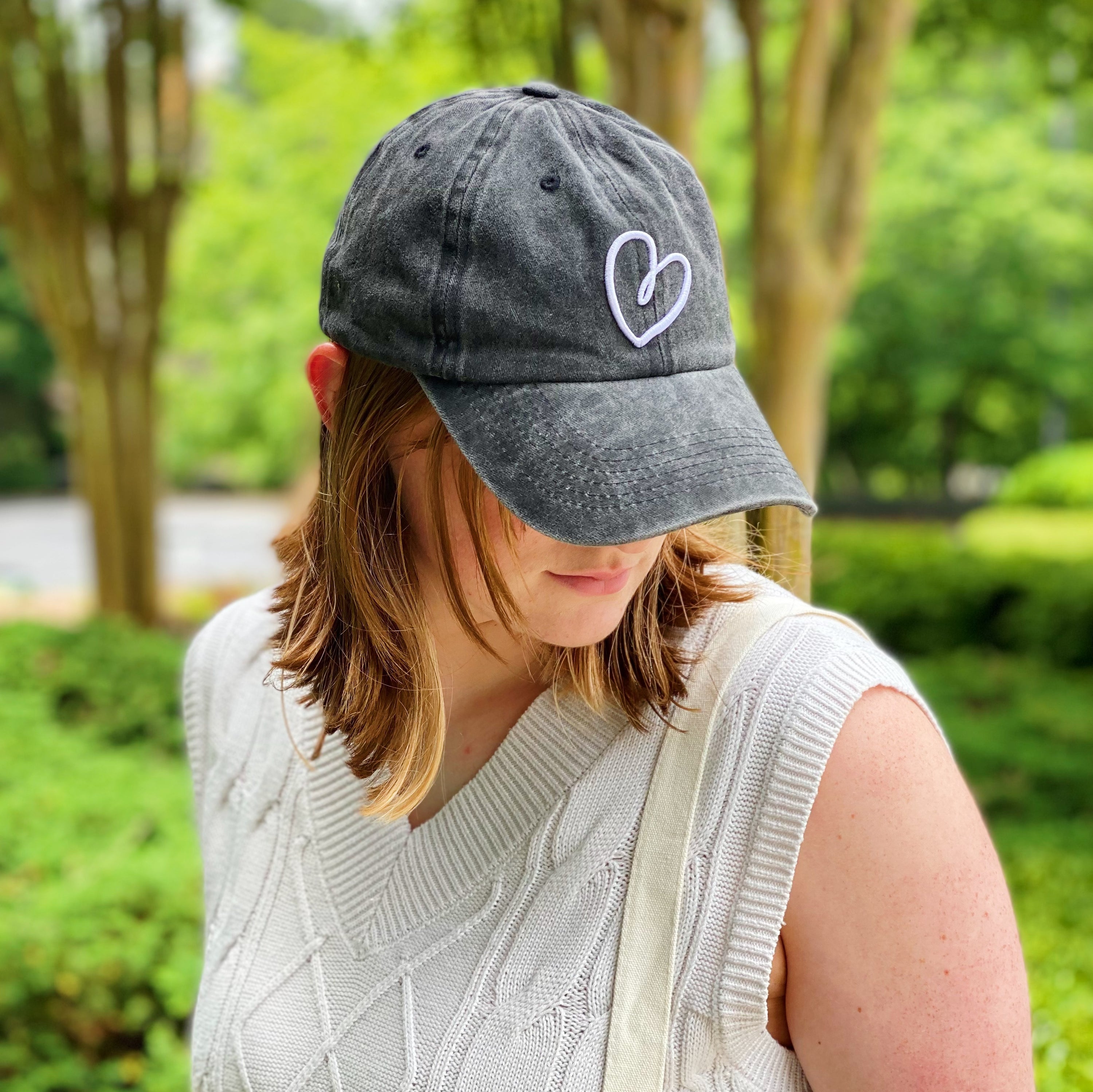 Dreaming Heart Ball Cap featuring 3D embroidery on washed cotton fabric, adjustable strap, and curved brim.