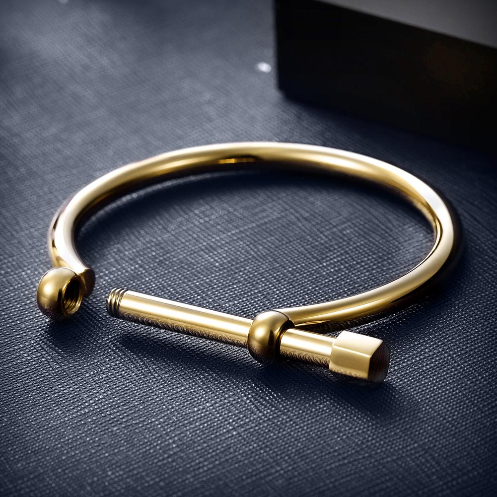 D-Shape Female Screw Bar Bangle made of 316L surgical stainless steel with 14K gold PVD plating, showcasing its elegant design.