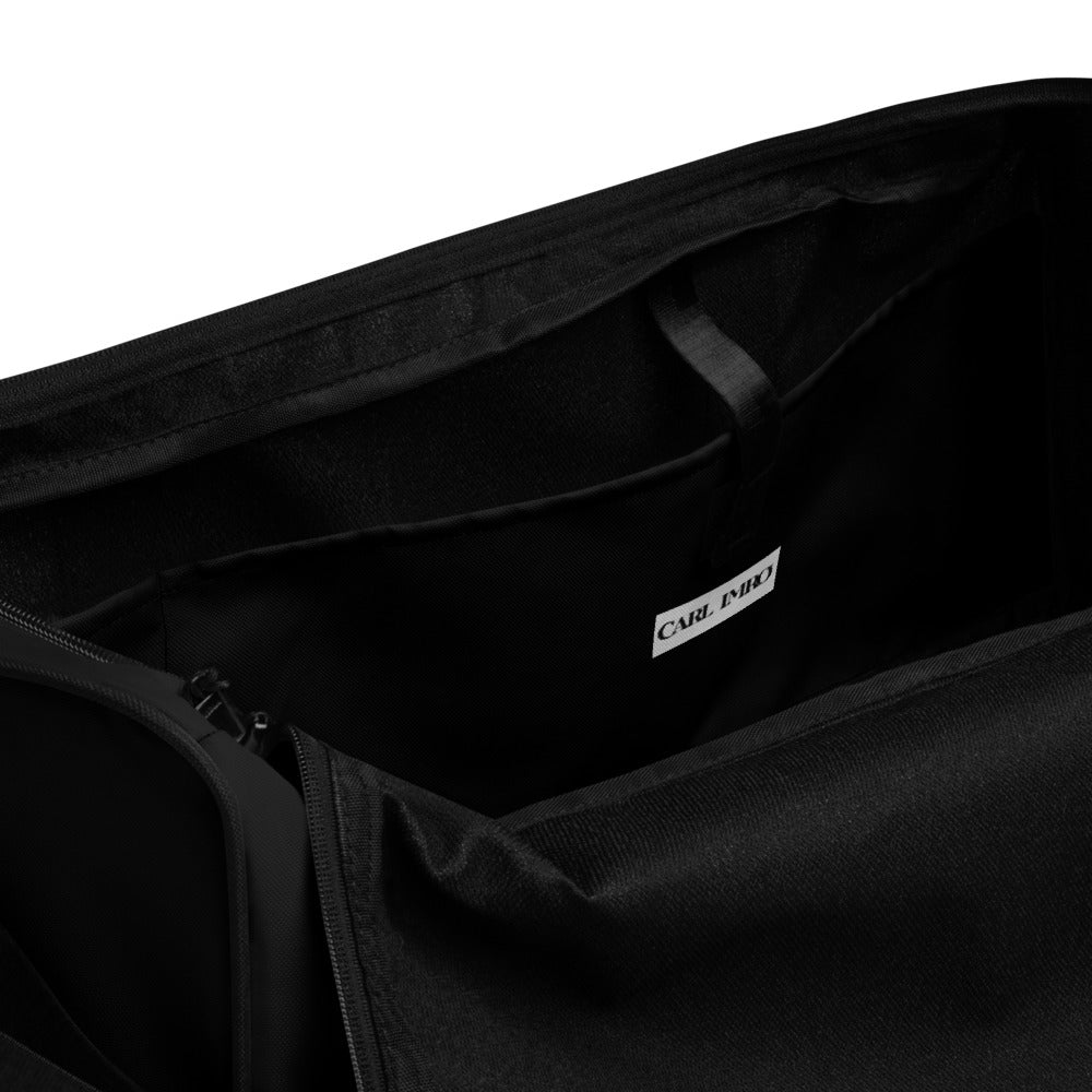 Duffle Bag PLBL in black with multiple pockets and adjustable shoulder strap, perfect for travel and gym use.