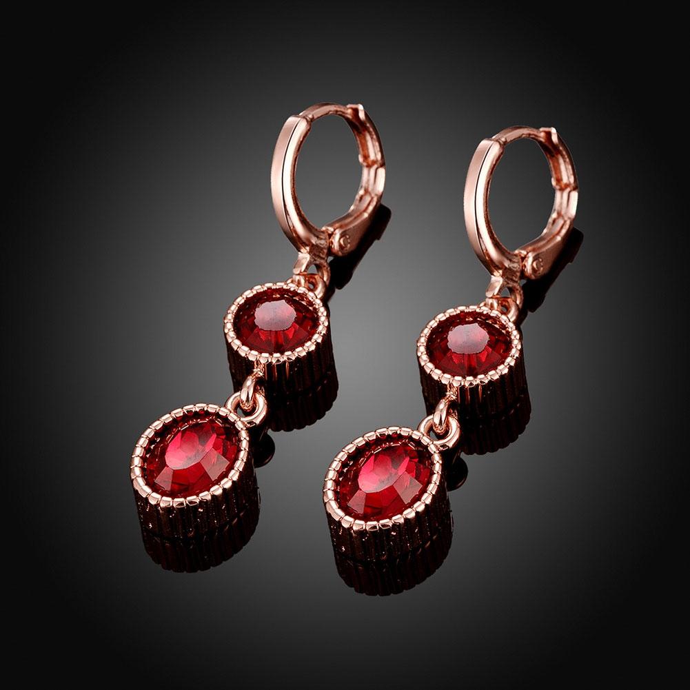 Duo Red Elements Drop earrings in 14K rose gold with certified crystals, showcasing elegant design and hypoallergenic features.