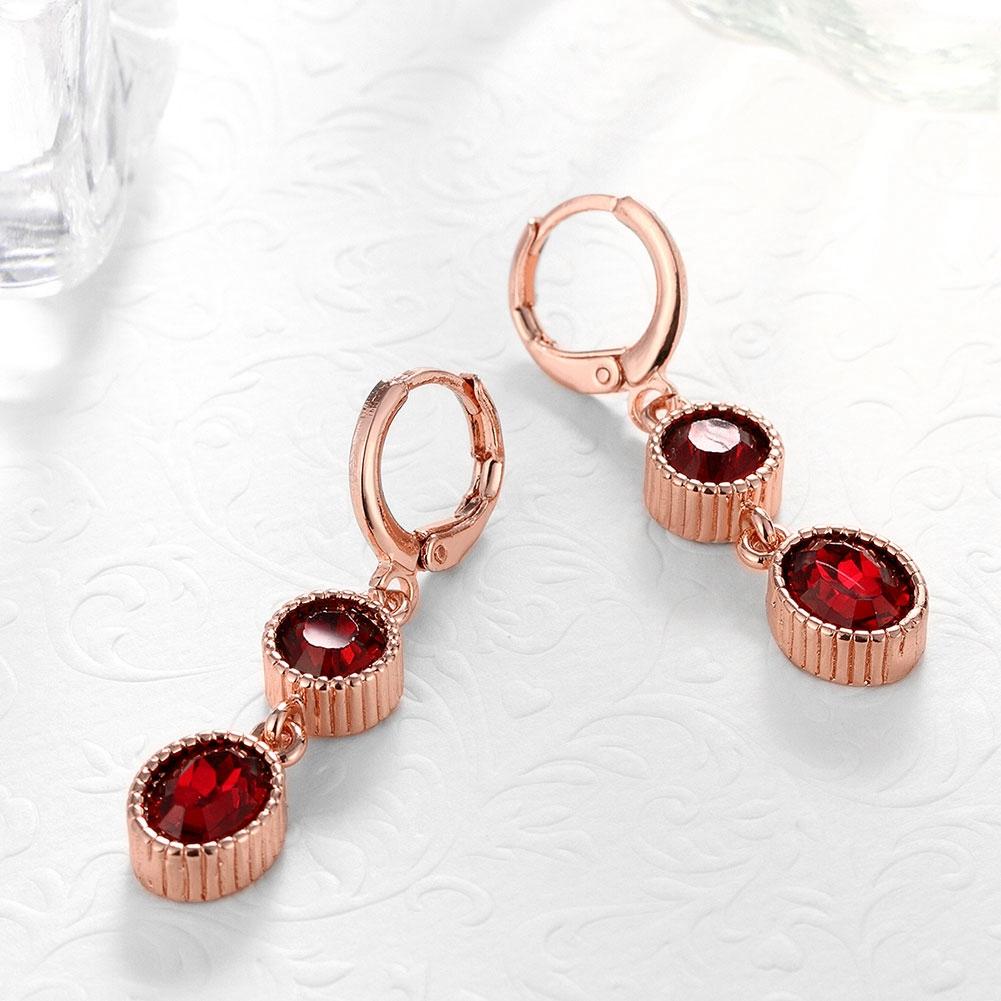 Duo Red Elements Drop earrings in 14K rose gold with certified crystals, showcasing elegant design and hypoallergenic features.