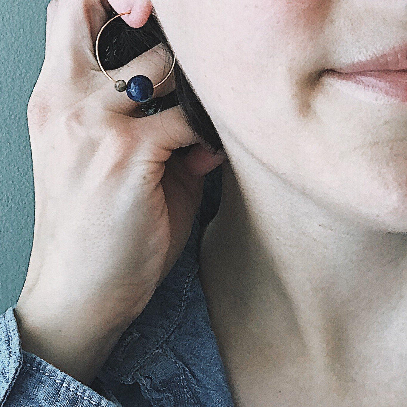 A pair of Earth and Moon Jasper Bead Hoop Earrings featuring colorful jasper beads on a raw brass hoop, showcasing a cosmic design.