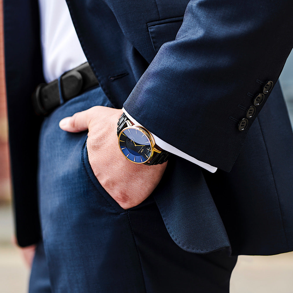 Eclipse Gold Gloss watch with Obsidian Black dial, featuring diamond cut hands and guilloche pattern.