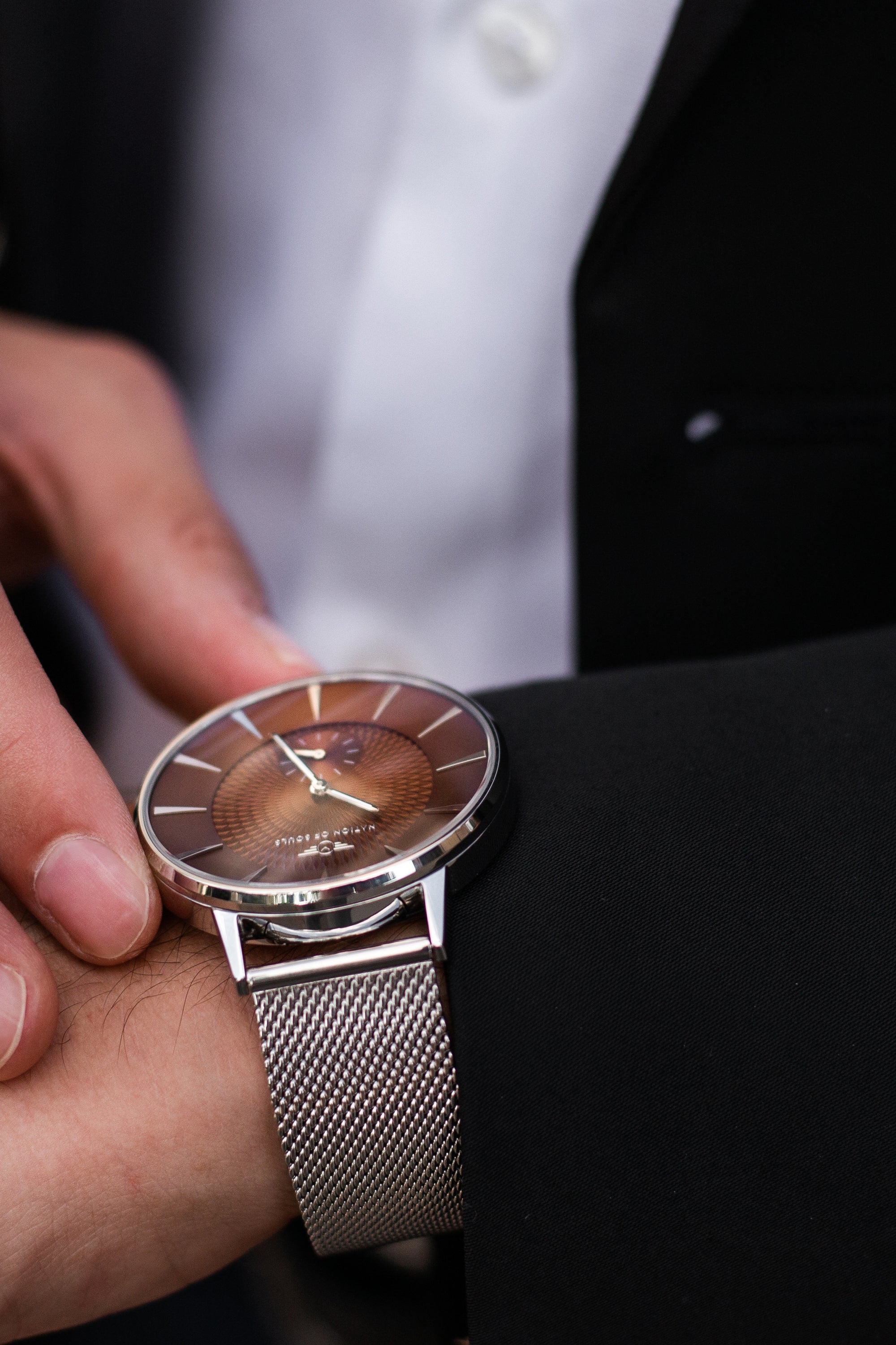 Eclipse Silver Gloss Coffee watch featuring a domed sapphire crystal, diamond cut hands, and a unique guilloche pattern dial.