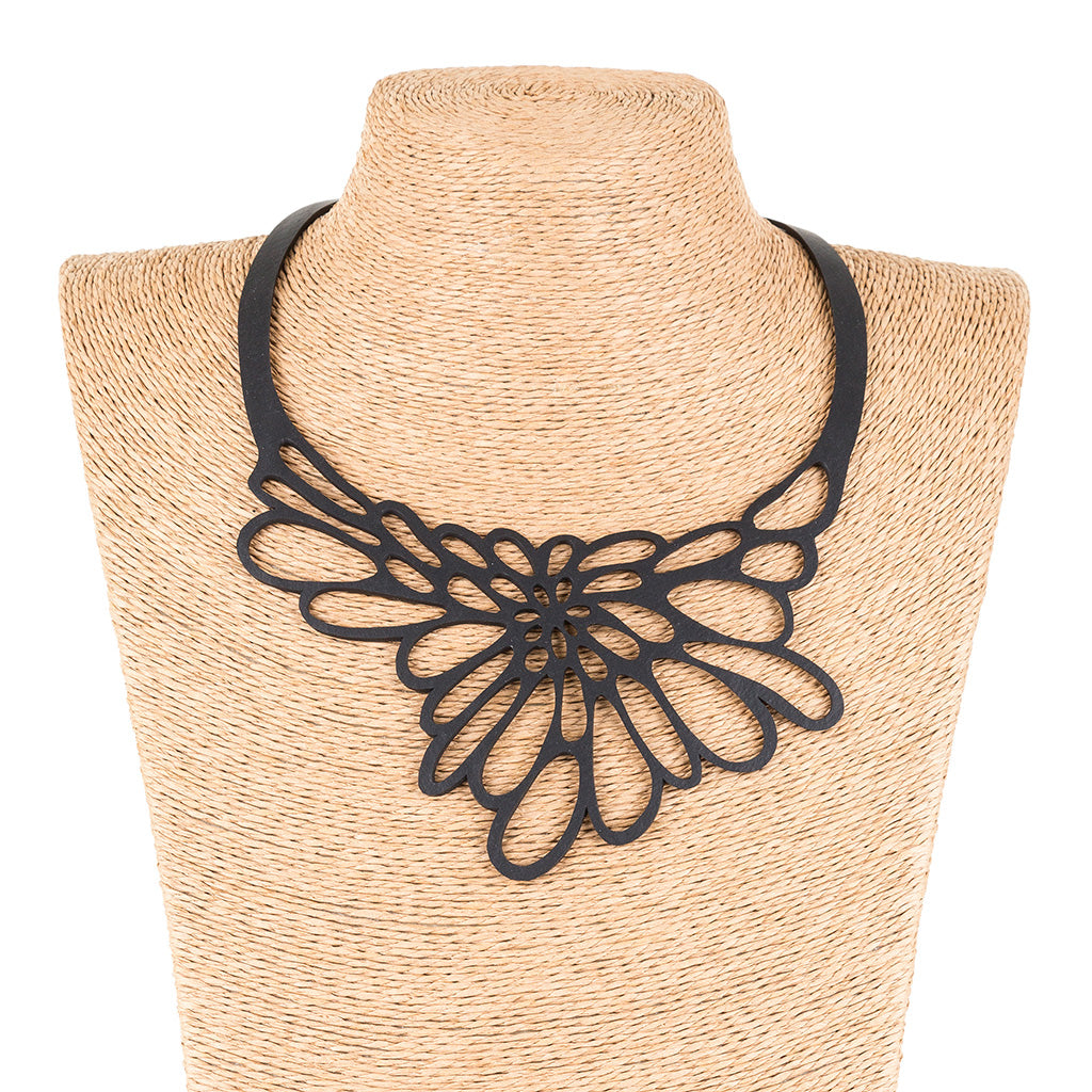 Edelweiss Upcycled Necklace made from recycled rubber, featuring a unique design inspired by the Edelweiss flower, displayed in a luxury gift box.