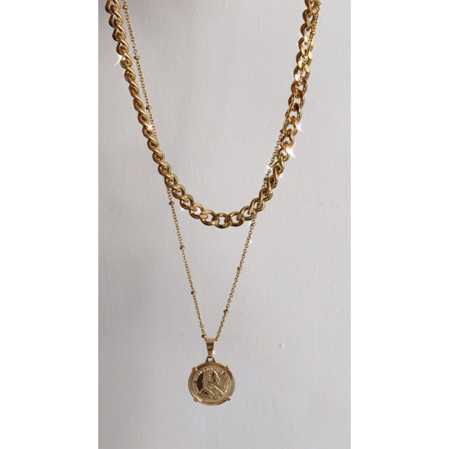 Edina Coin Necklace featuring a Cuban link chain and coin pendant, elegantly designed in 18k gold plated stainless steel.