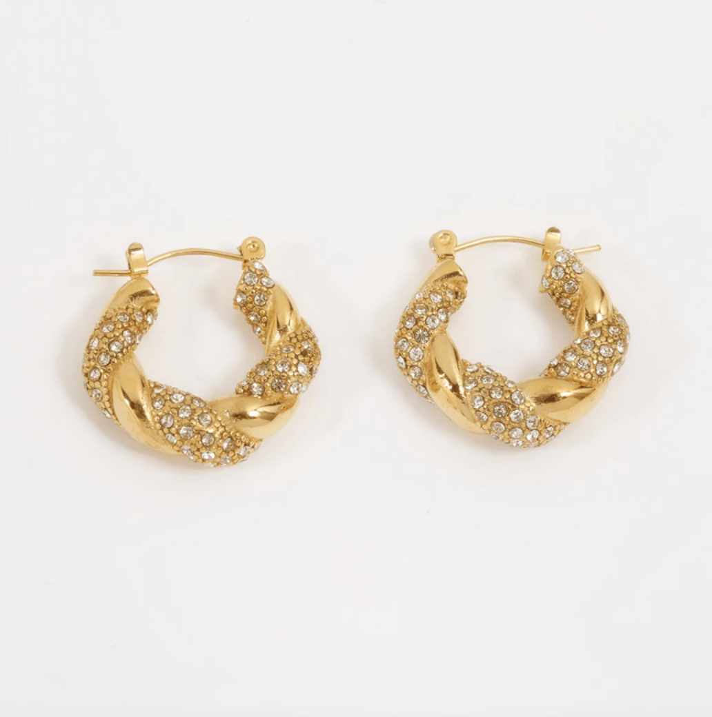 Elegant Egypt twist hoop earrings made of stainless steel with 18K gold PVD plating and zircon crystal pavé, showcasing a unique twist design.