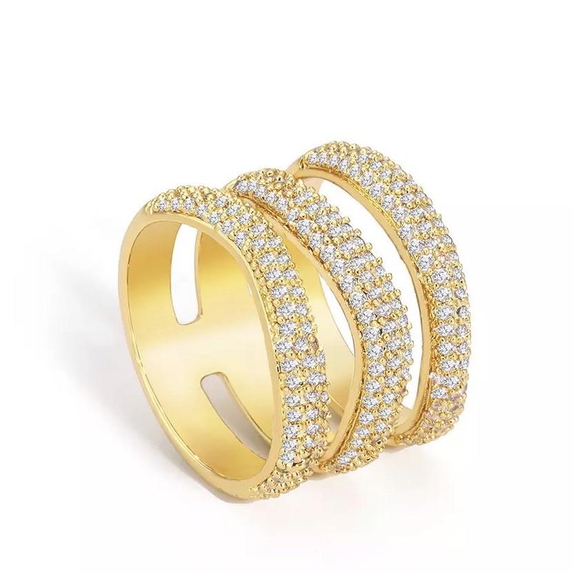 Elle Pave Ring featuring a wide band design with pave cubic zirconia stones, elegantly plated in 18k gold over stainless steel.