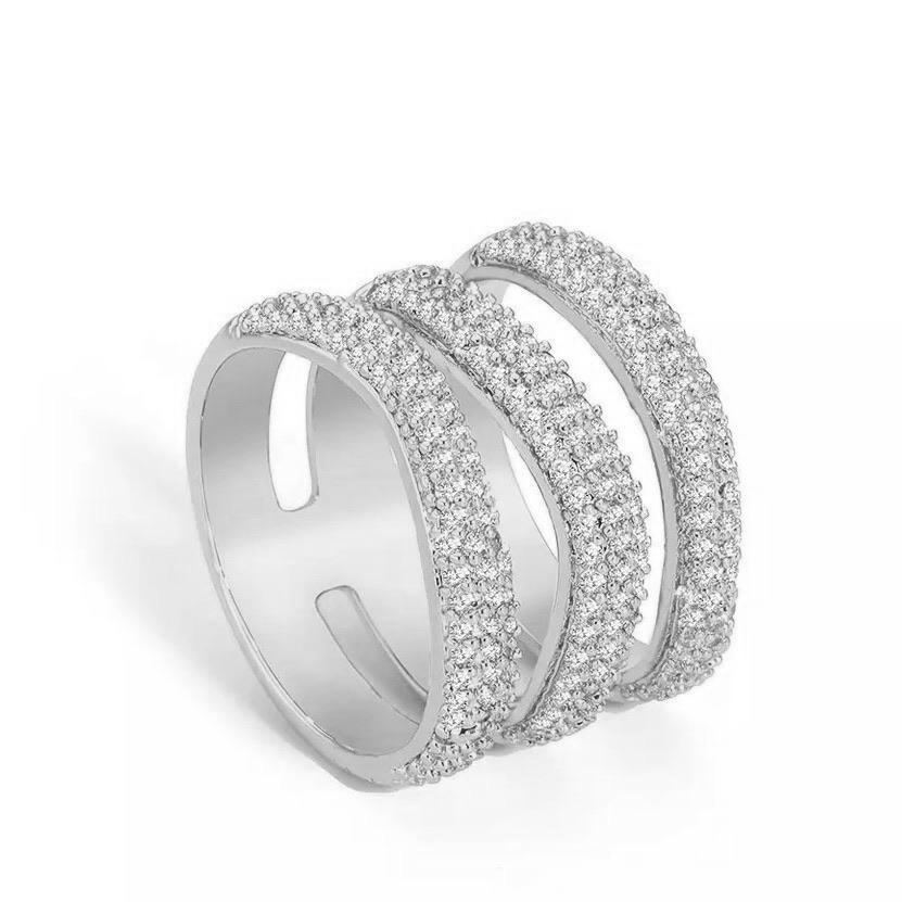 Elle Pave Ring featuring a wide band design with pave cubic zirconia stones, elegantly plated in 18k gold over stainless steel.