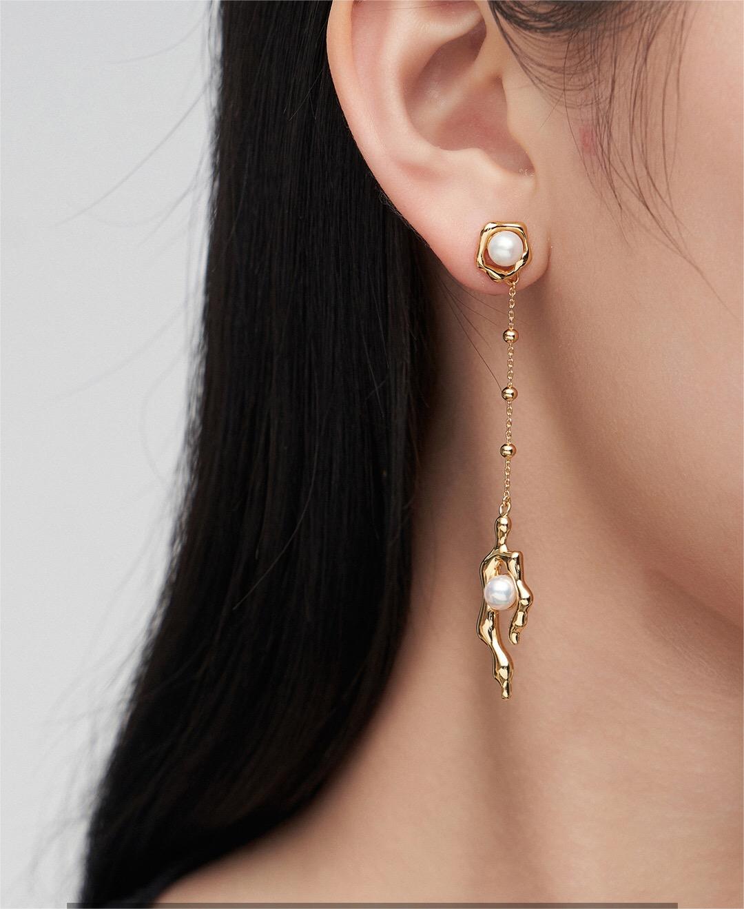 Elegant Asymmetric Pearl Earrings featuring natural pearls and sterling silver with gold vermeil, showcasing a unique design.