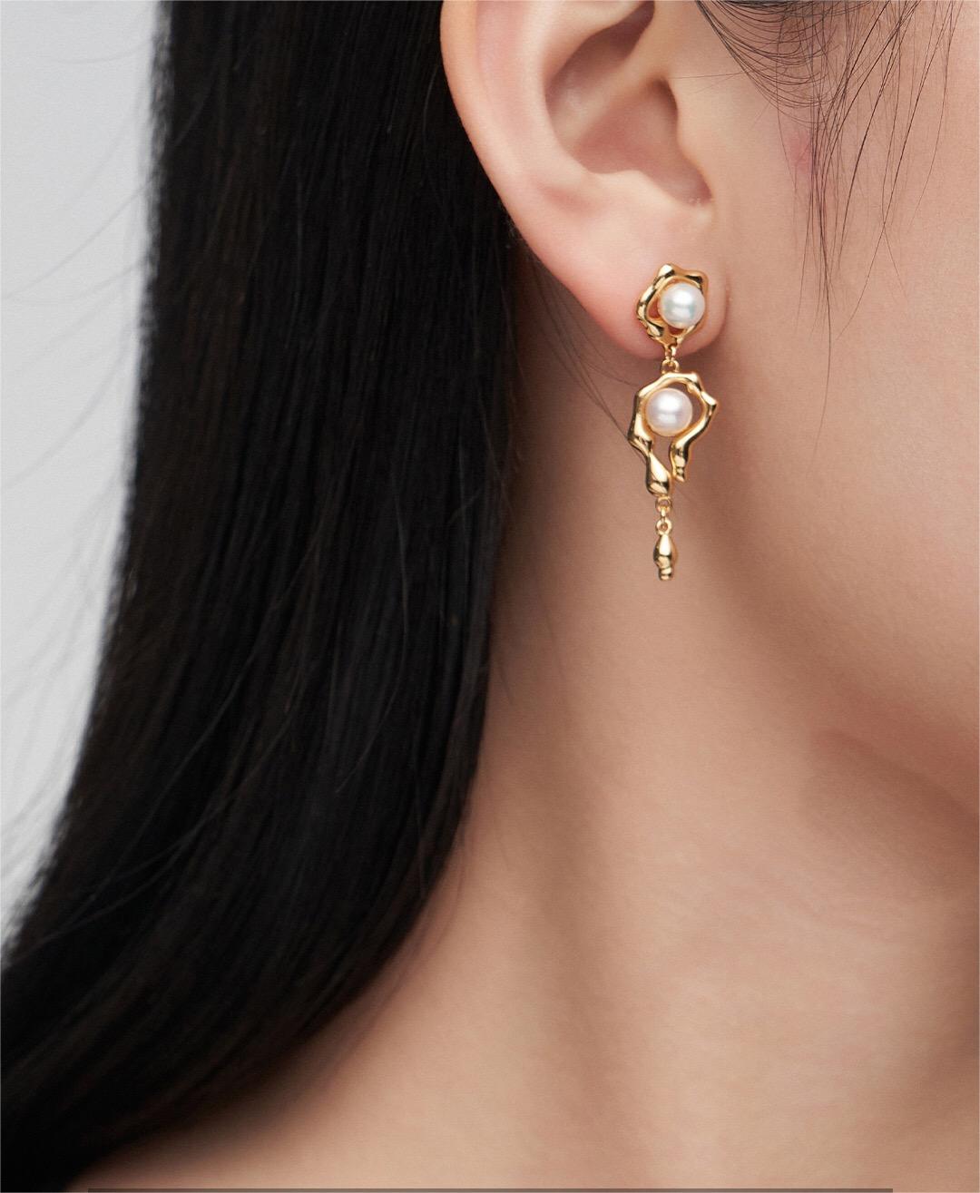 Elegant Asymmetric Pearl Earrings featuring natural pearls and sterling silver with gold vermeil, showcasing a unique design.