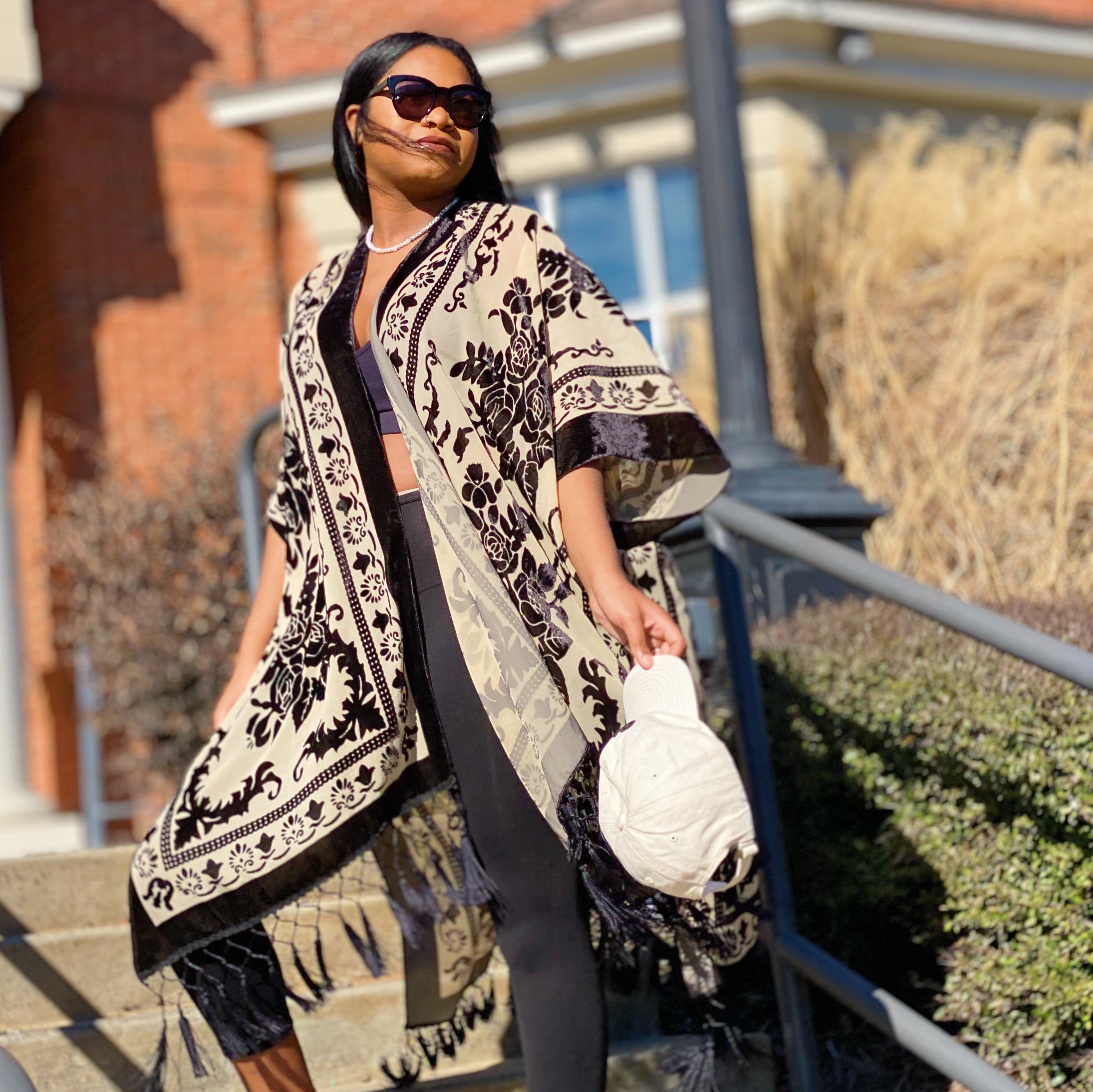 Elegant Boho Burnout Kimono featuring fringed bottoms and velvet details, showcasing its luxurious design and silky tassels.