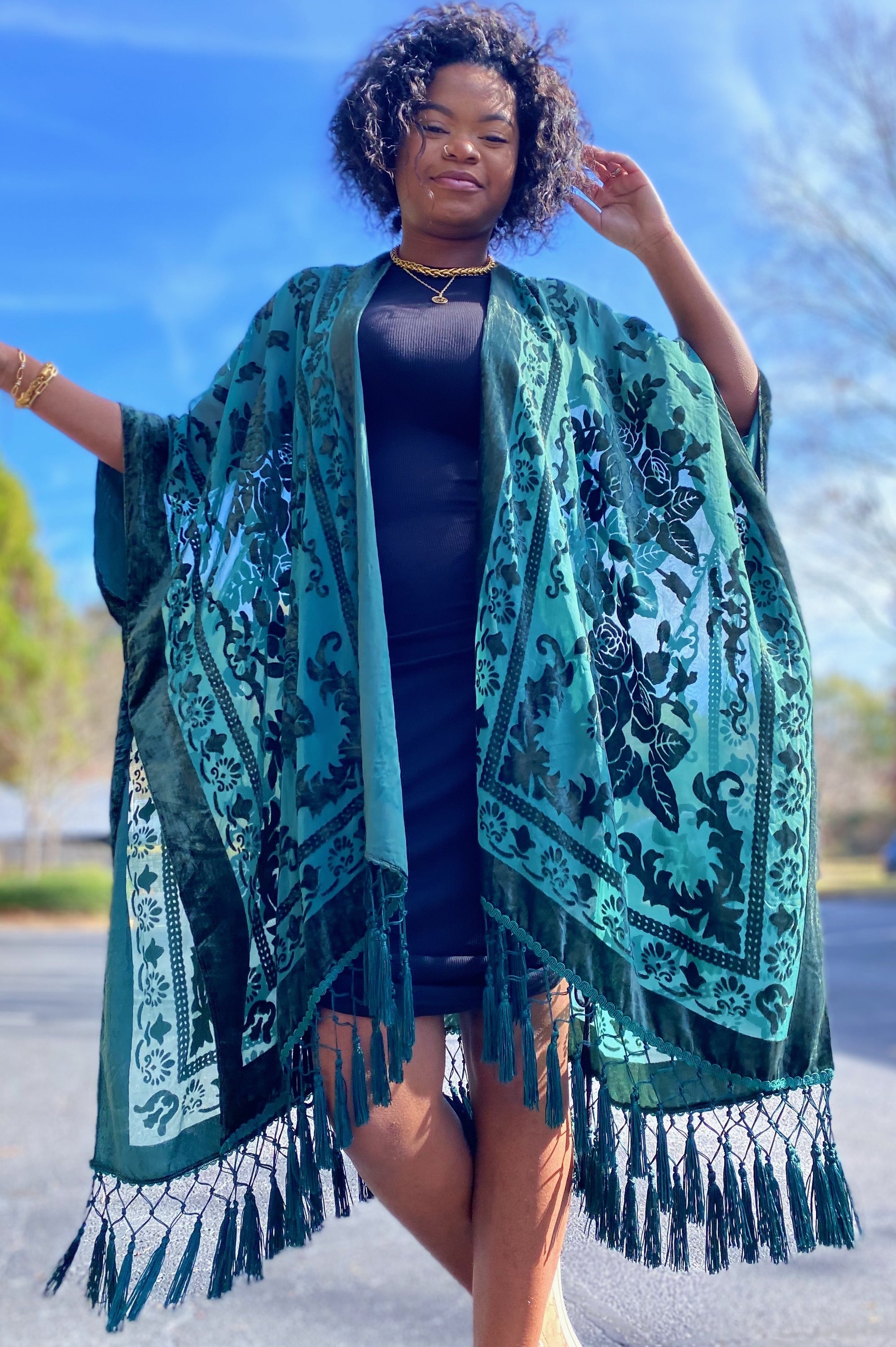 Elegant Boho Burnout Kimono featuring fringed bottoms and velvet details, showcasing its luxurious design and silky tassels.