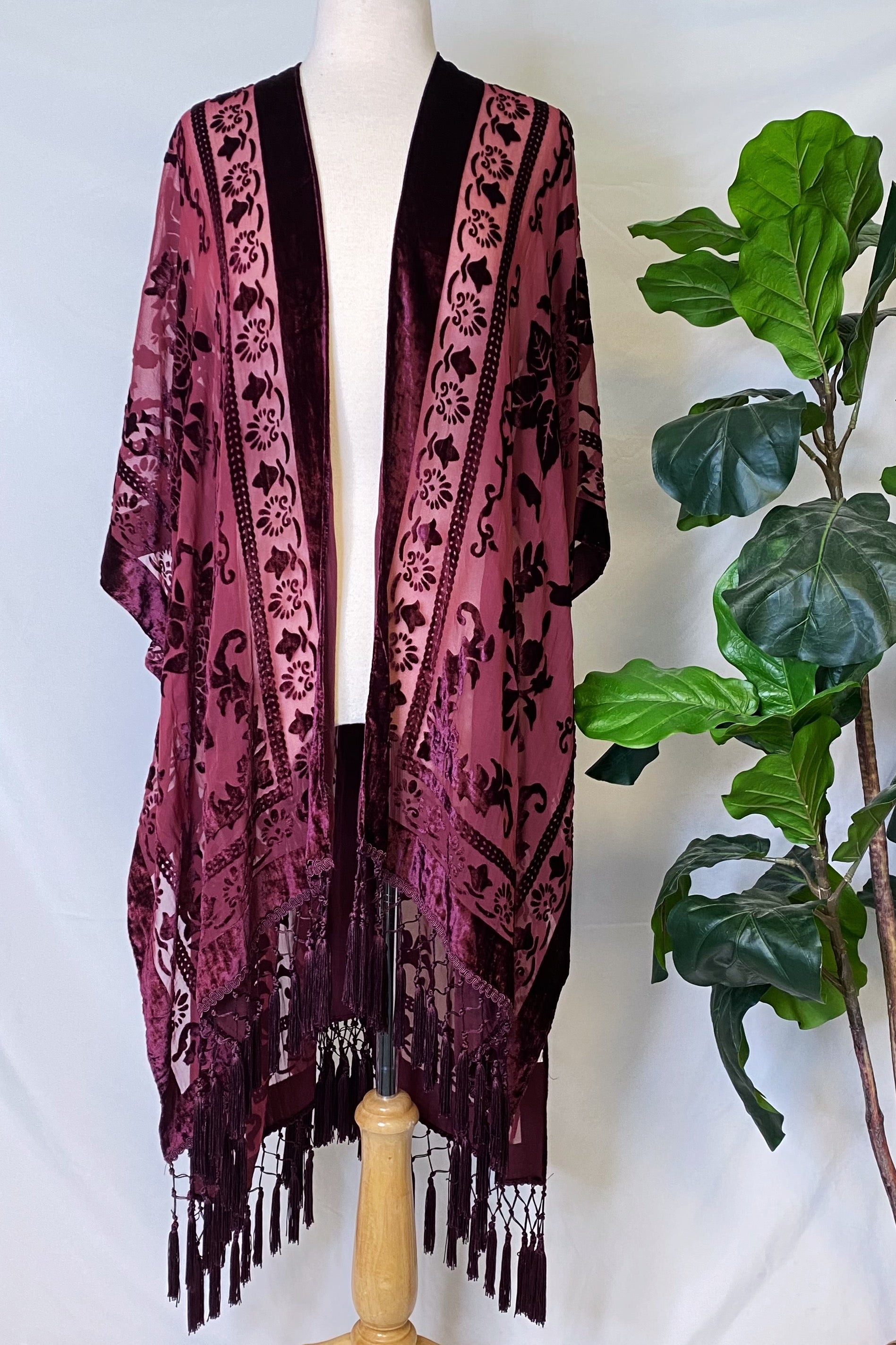 Elegant Boho Burnout Kimono featuring fringed bottoms and velvet details, showcasing its luxurious design and silky tassels.